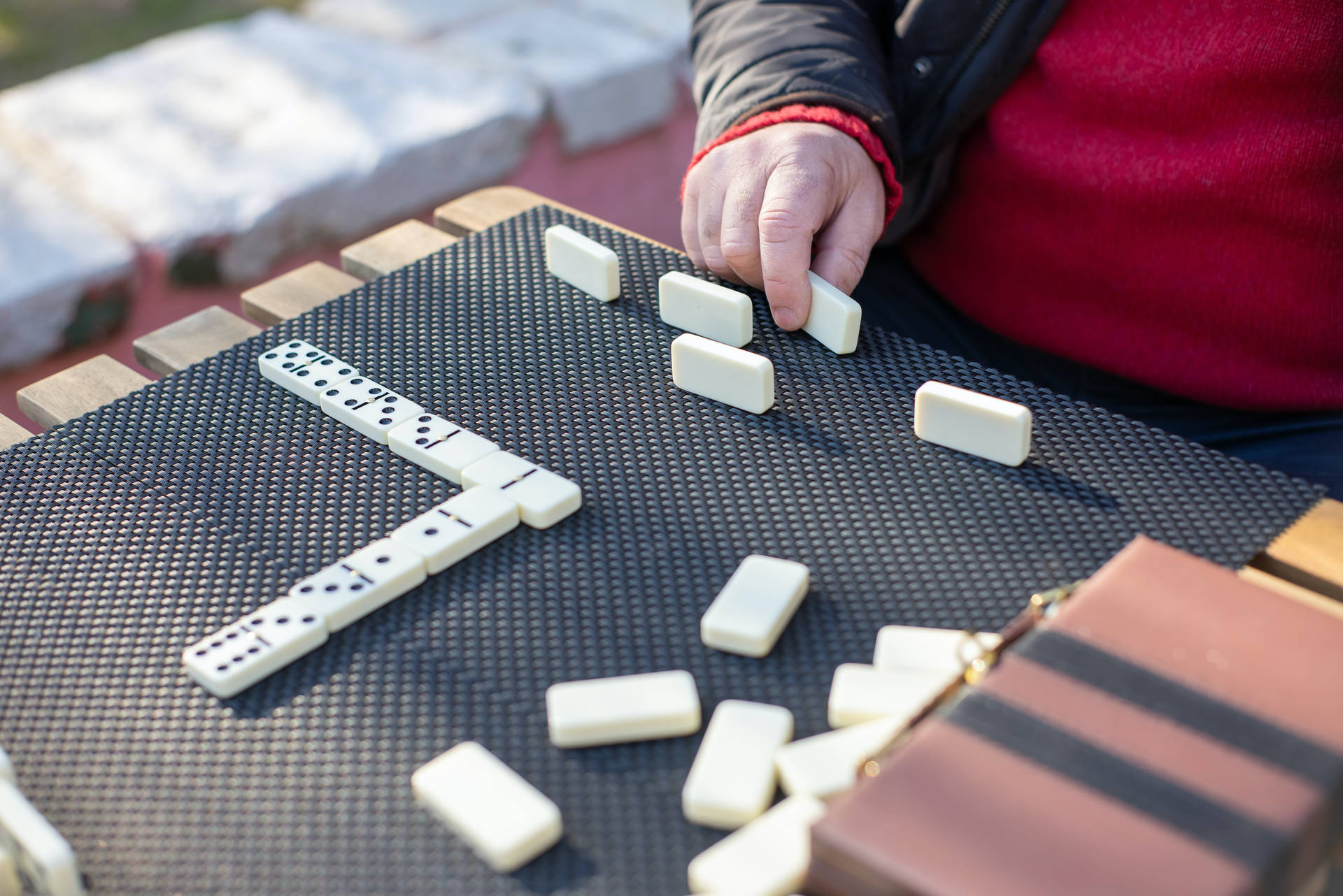 Playing Dominos On Table Background