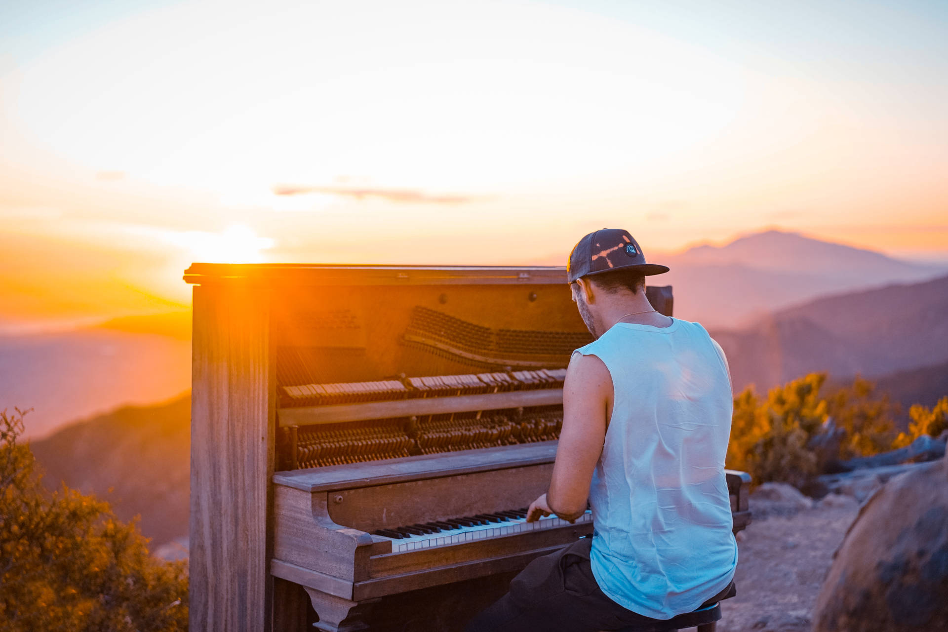 Playing Piano During Sunrise Background