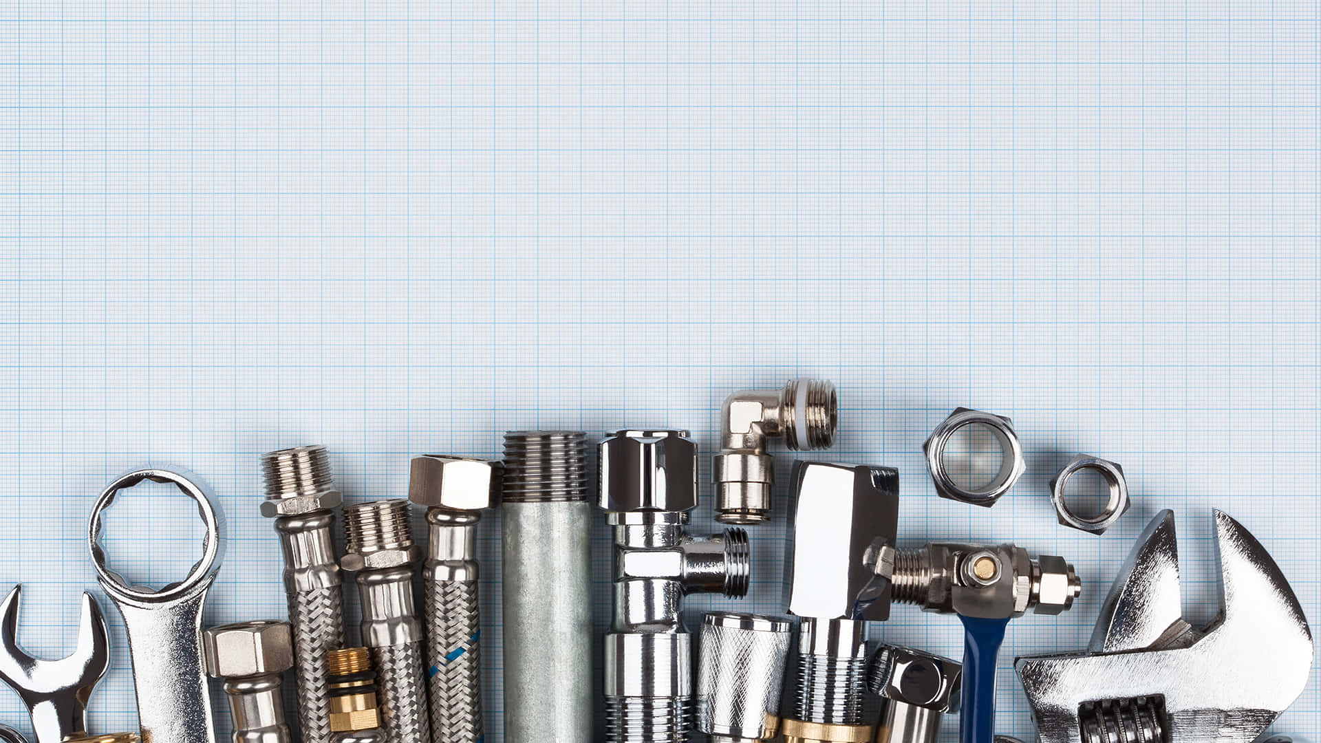 Plumbing Tools And Fittings On White Gridlines Background