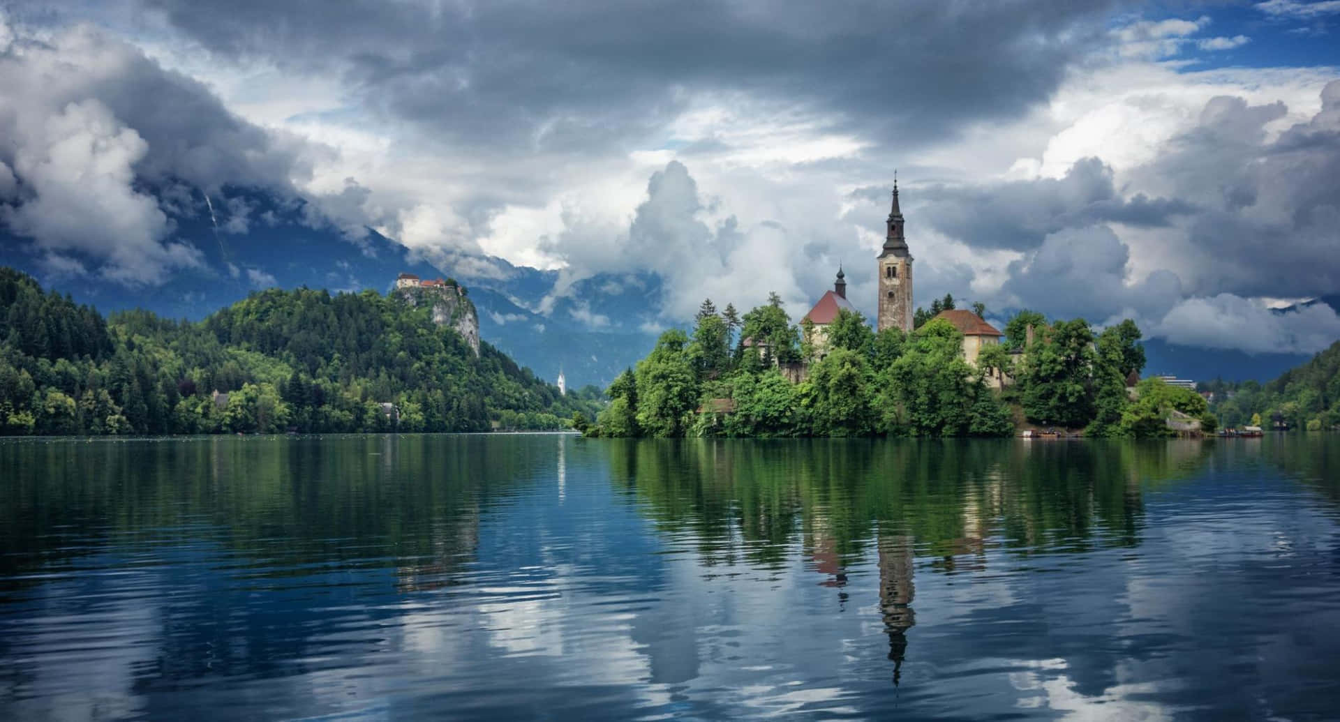 Plump Clouds Above Lake Bled Background