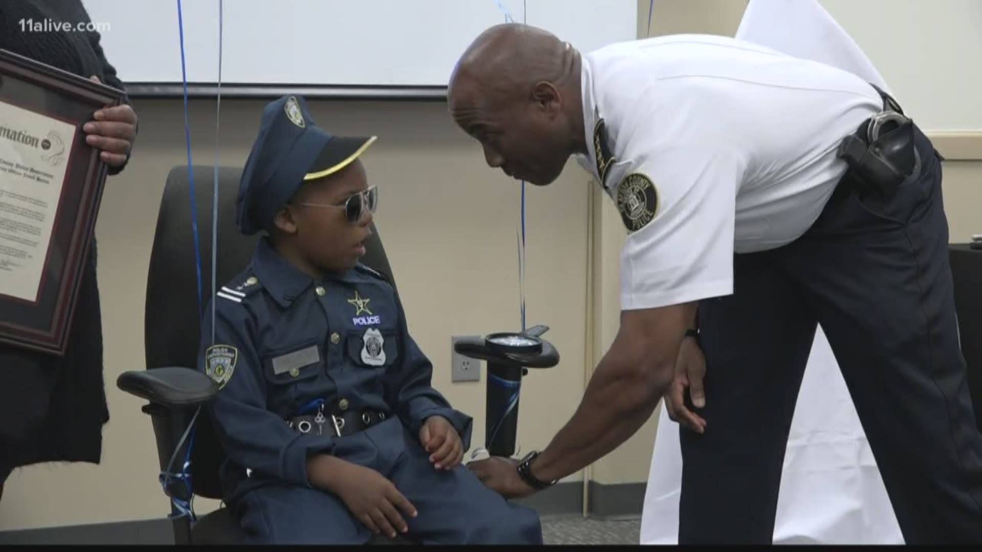 Police Officer Honors Boy Background