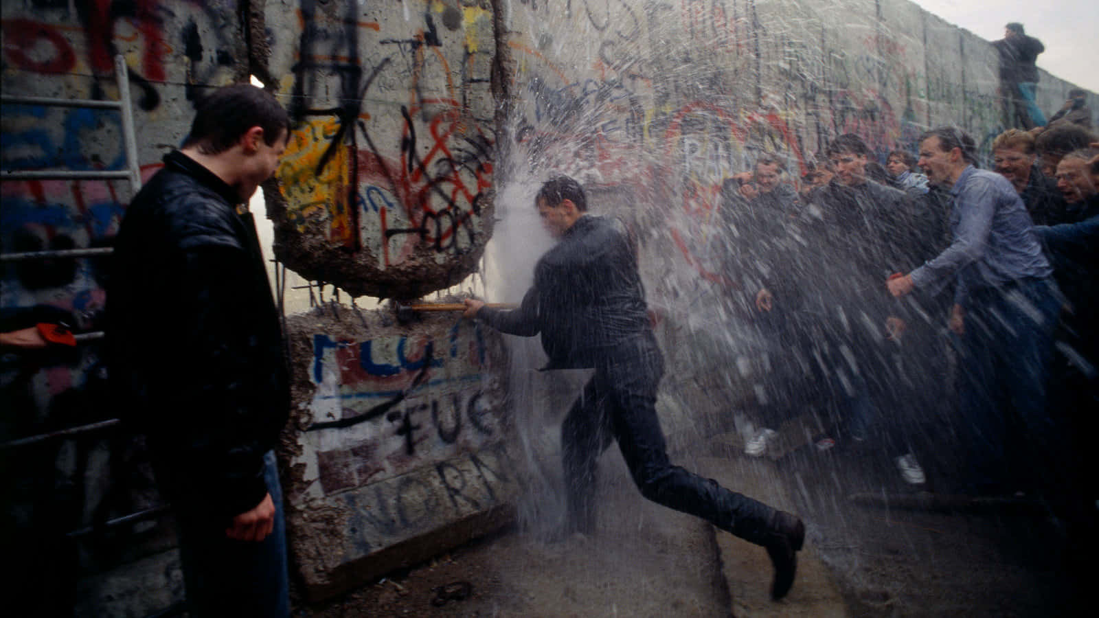 Police Spraying West Germans In Berlin Wall Background