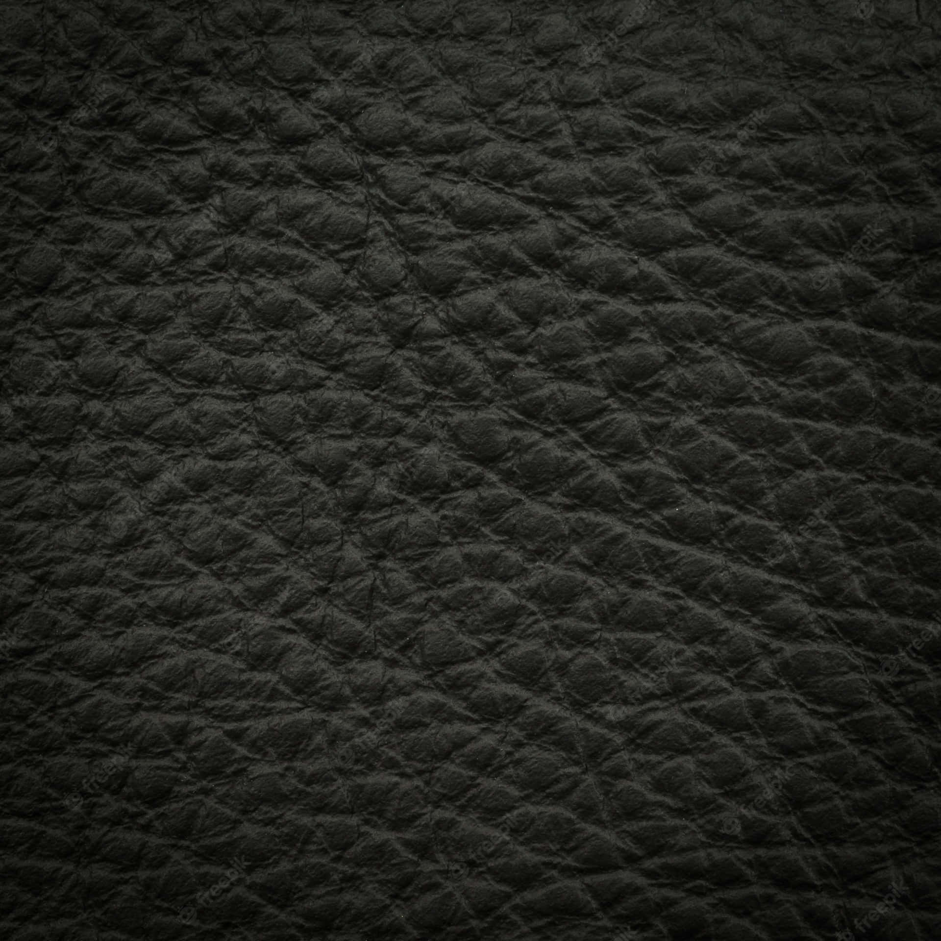 Polished Black Leather Exudes Luxury And Sophistication. Background