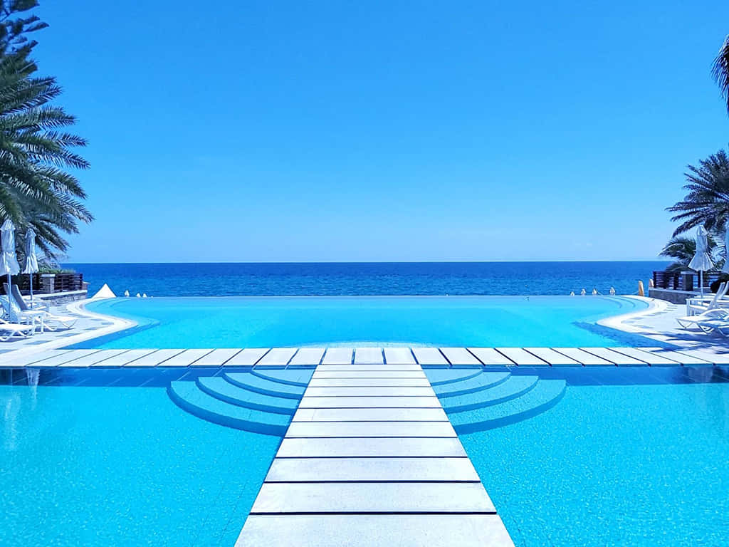 Pool Resort Over The Beach Background