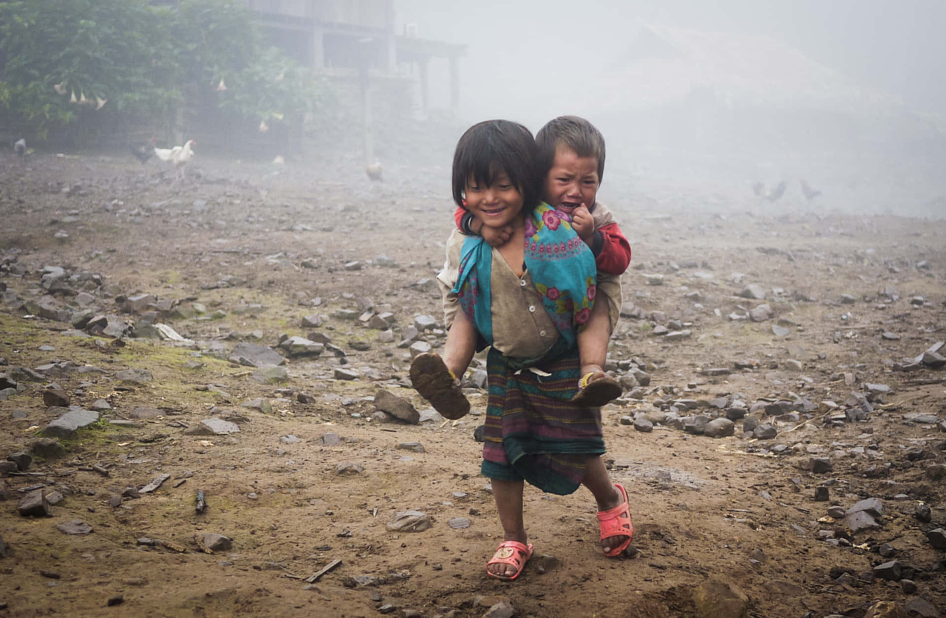 Poor Little Girl Carrying Her Brother