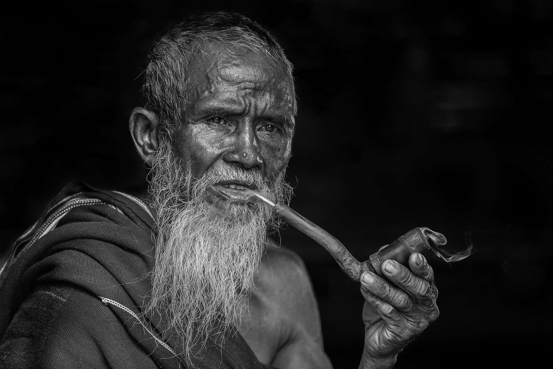 Poor Old Man Smoking Tobacco Pipe