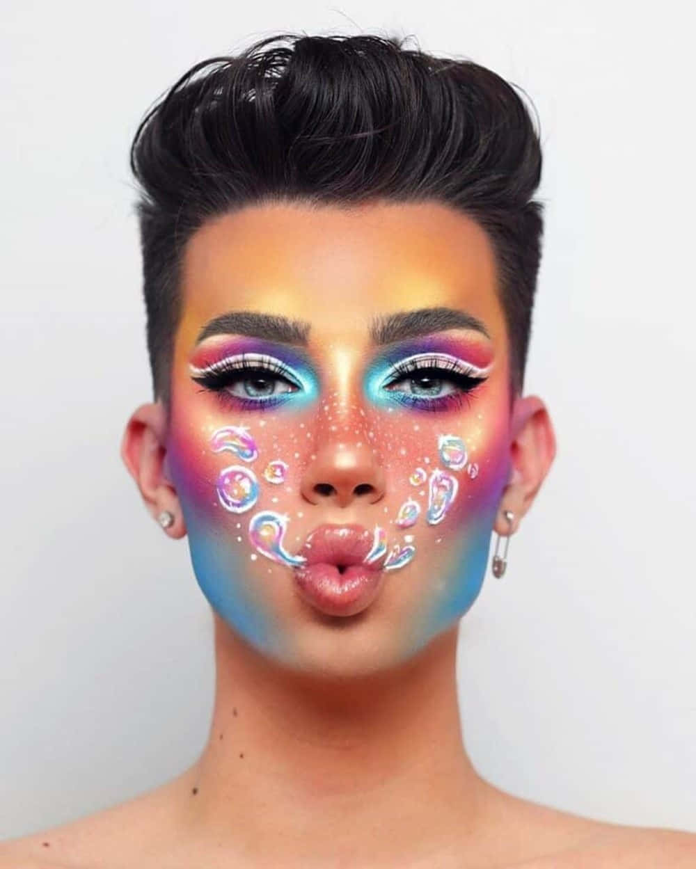 Popular Makeup Artist James Charles Wearing A Bold, Bright Look. Background