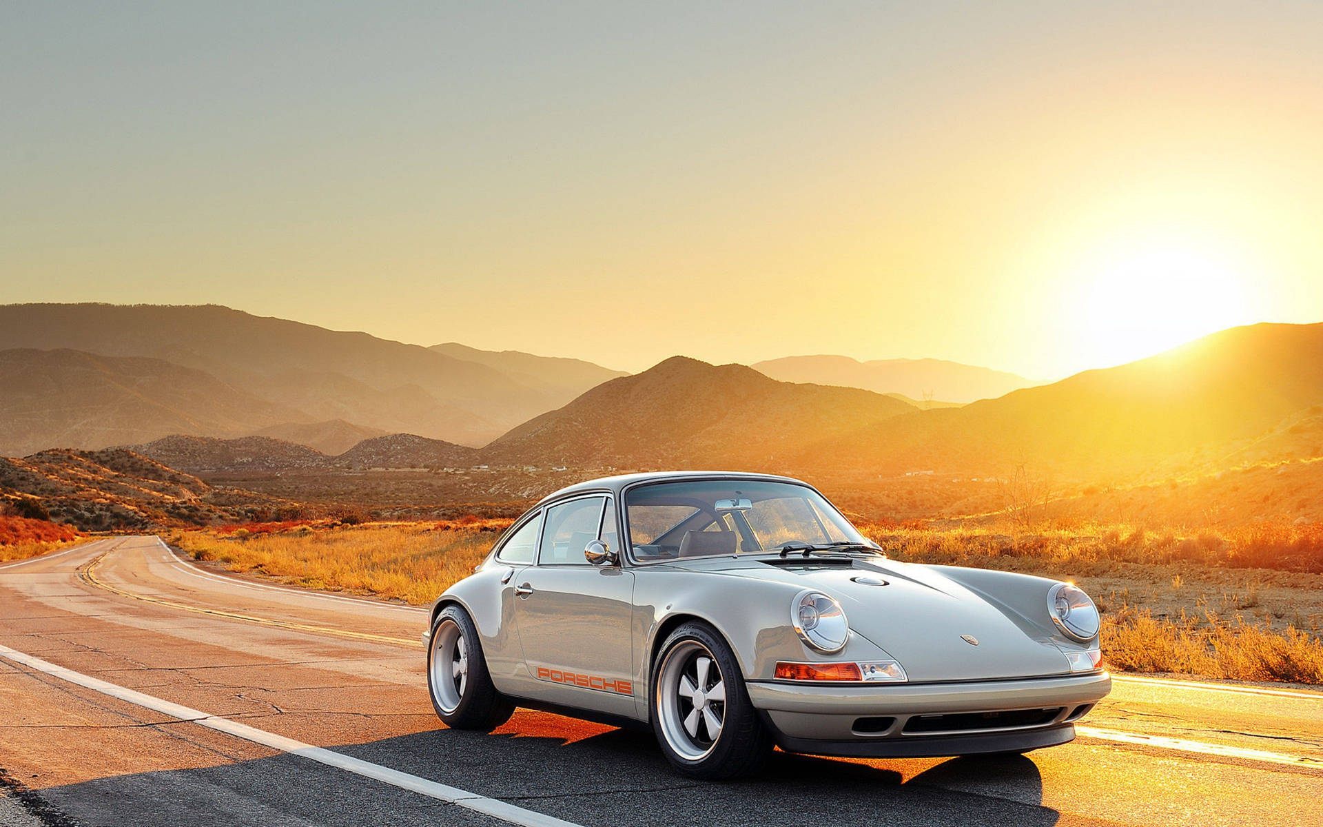 Porsche 911 And Golden Sunrise Background