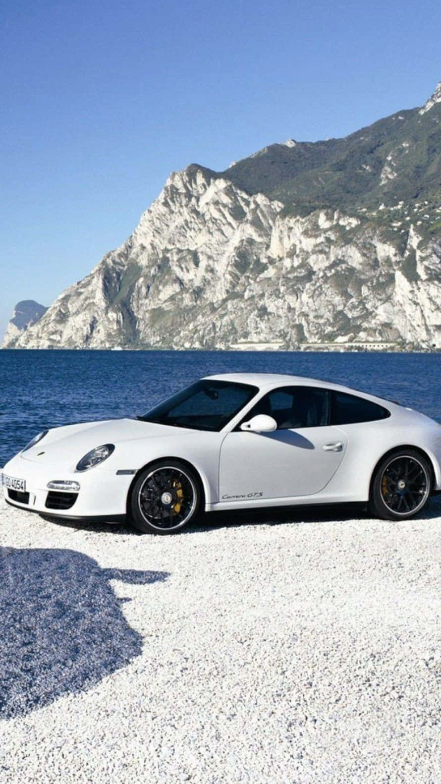 Porsche 911 Gts - A White Sports Car Parked On The Beach Background