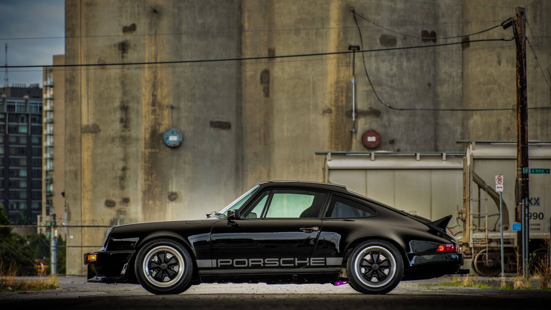 Porsche 911 In Glossy Black Paint Background