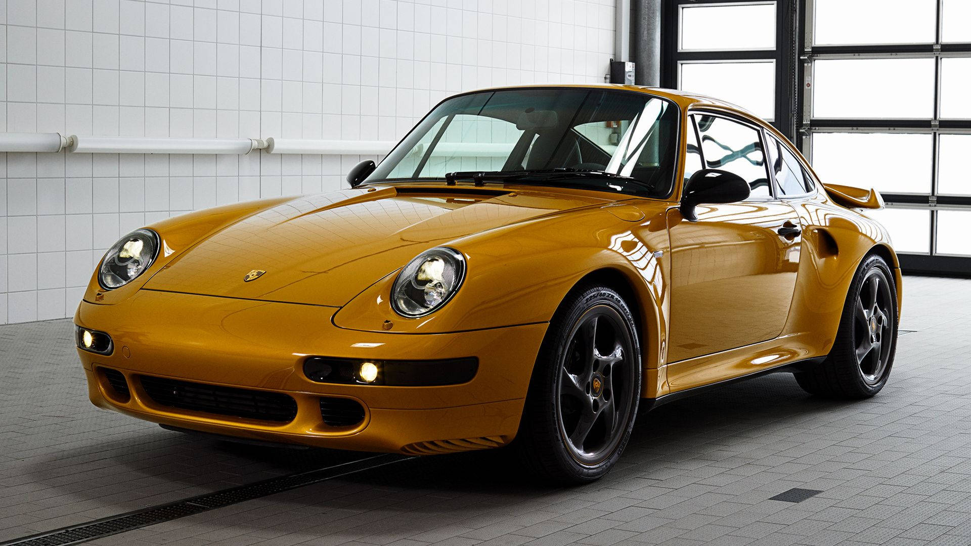 Porsche 911 In Gold Glossy Finish Background