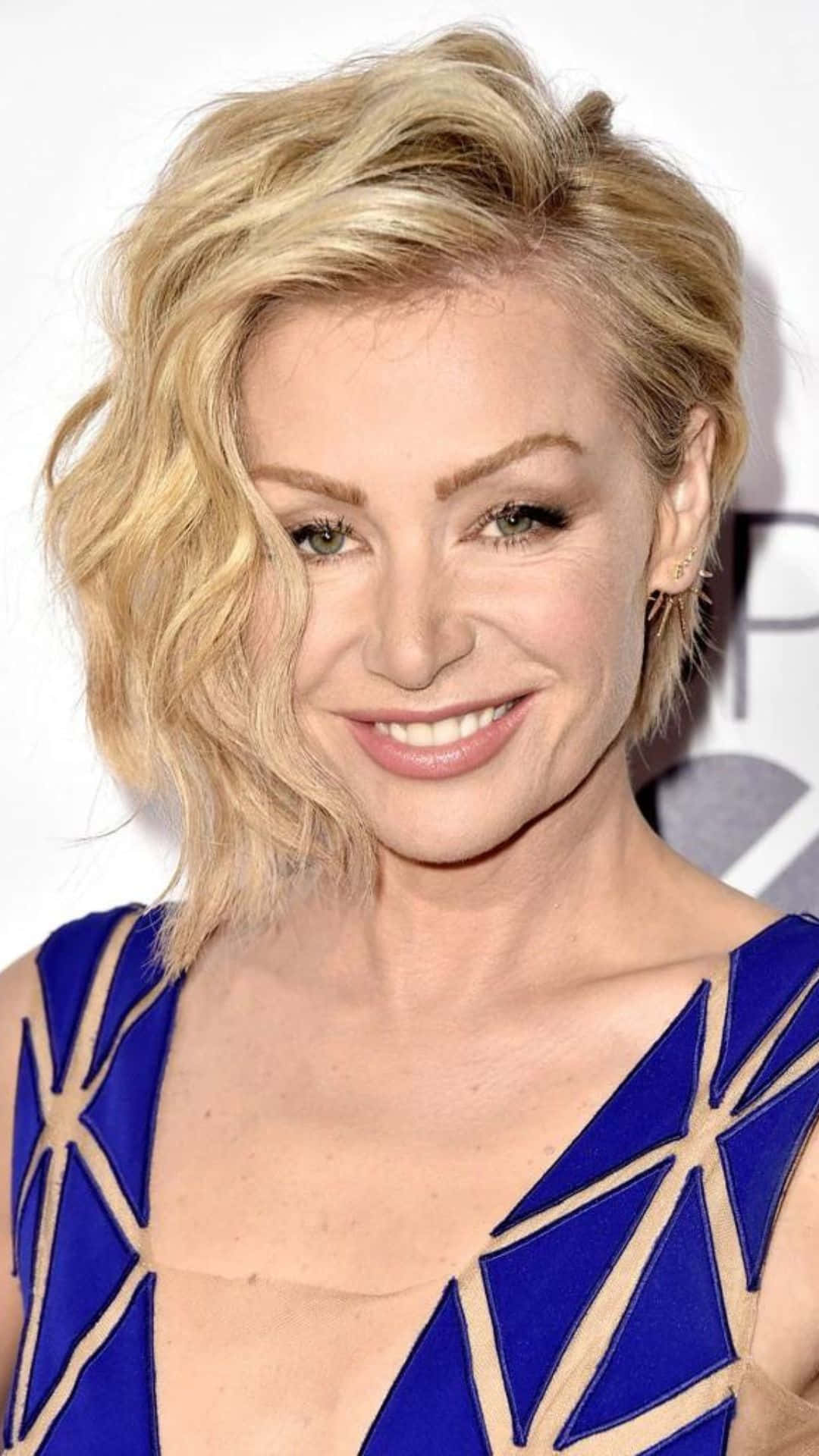 Portia De Rossi Blonde Hairstyle Blue Dress Background