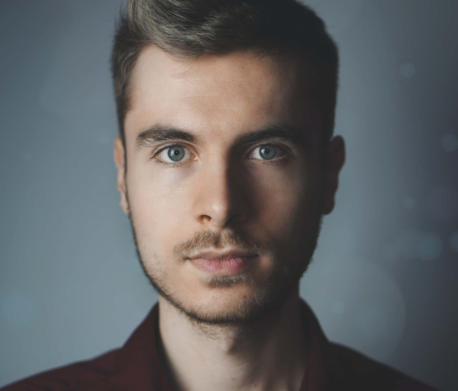 Portrait Of A Man With Blue Eyes Background