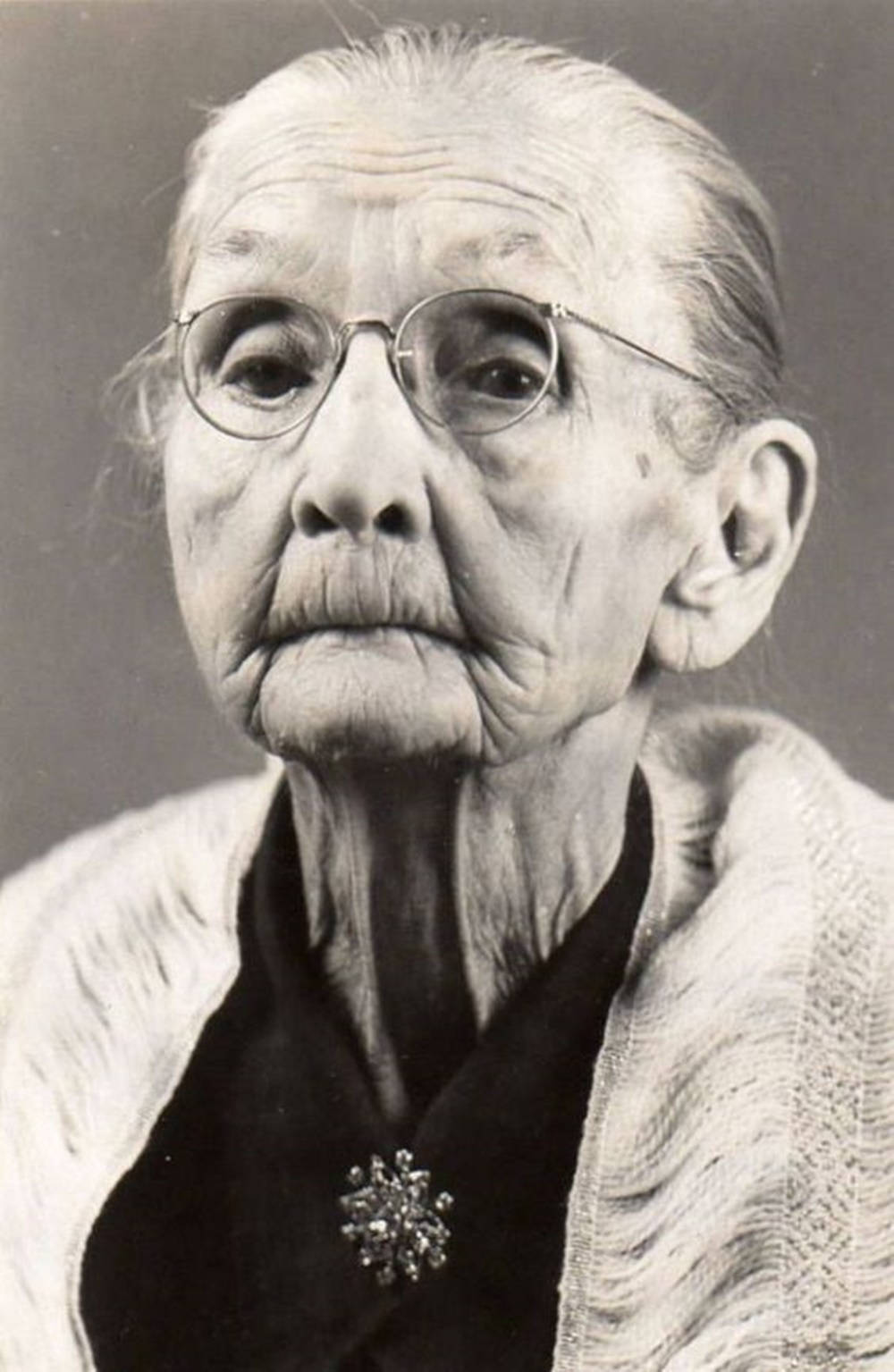 Portrait Of An Aged Woman With Grace Background