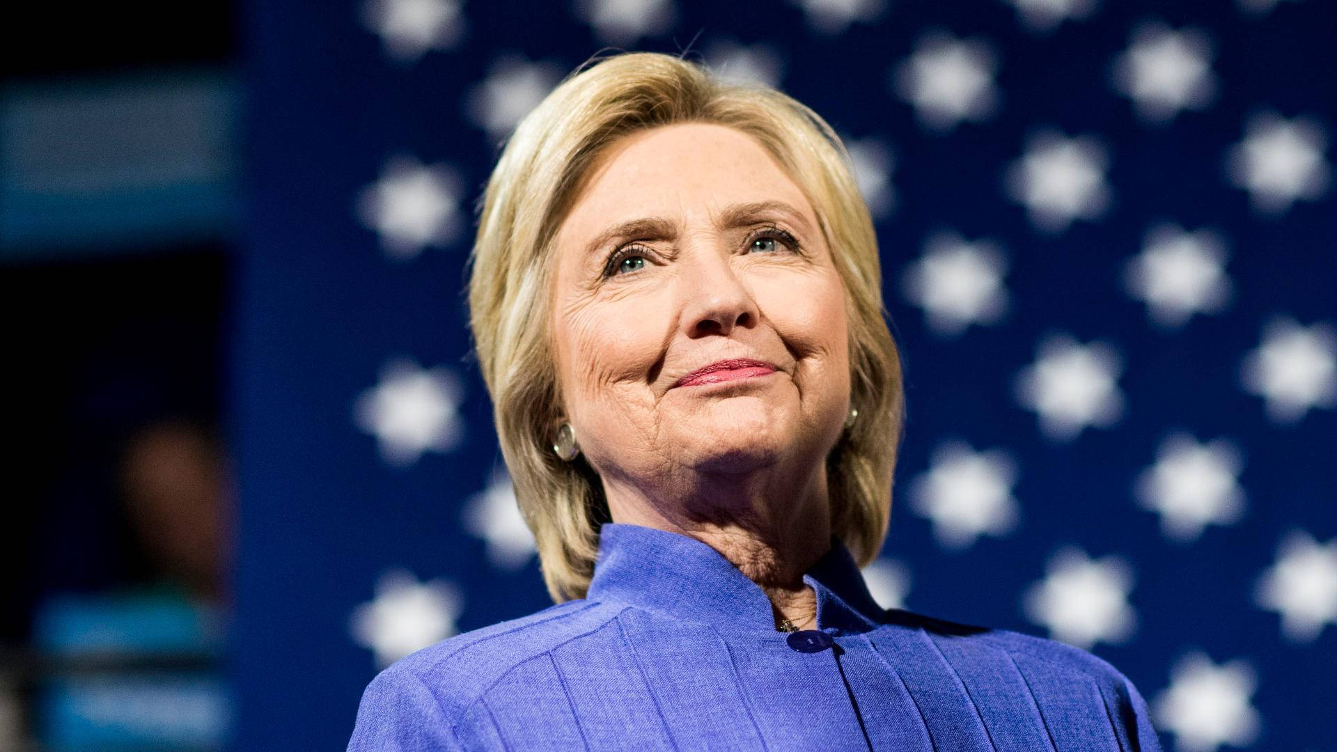 Portrait Of Hillary Clinton Looking Upward Background