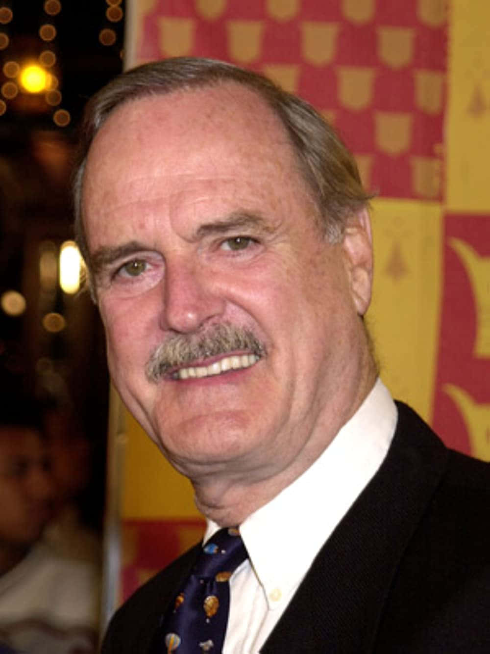 Portrait Of John Cleese, Iconic British Comedian. Background