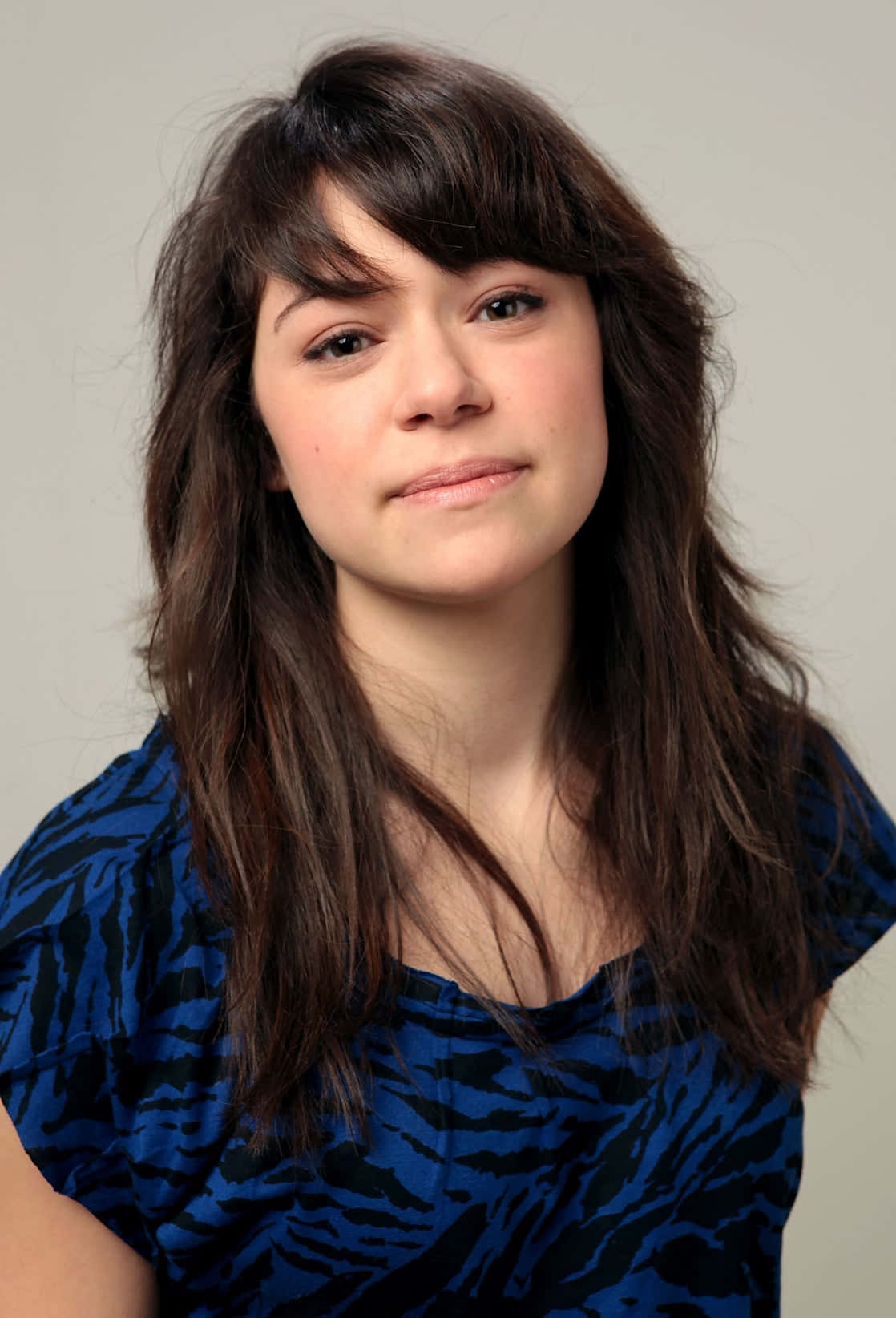 Portraitof Young Womanin Blue Top Background