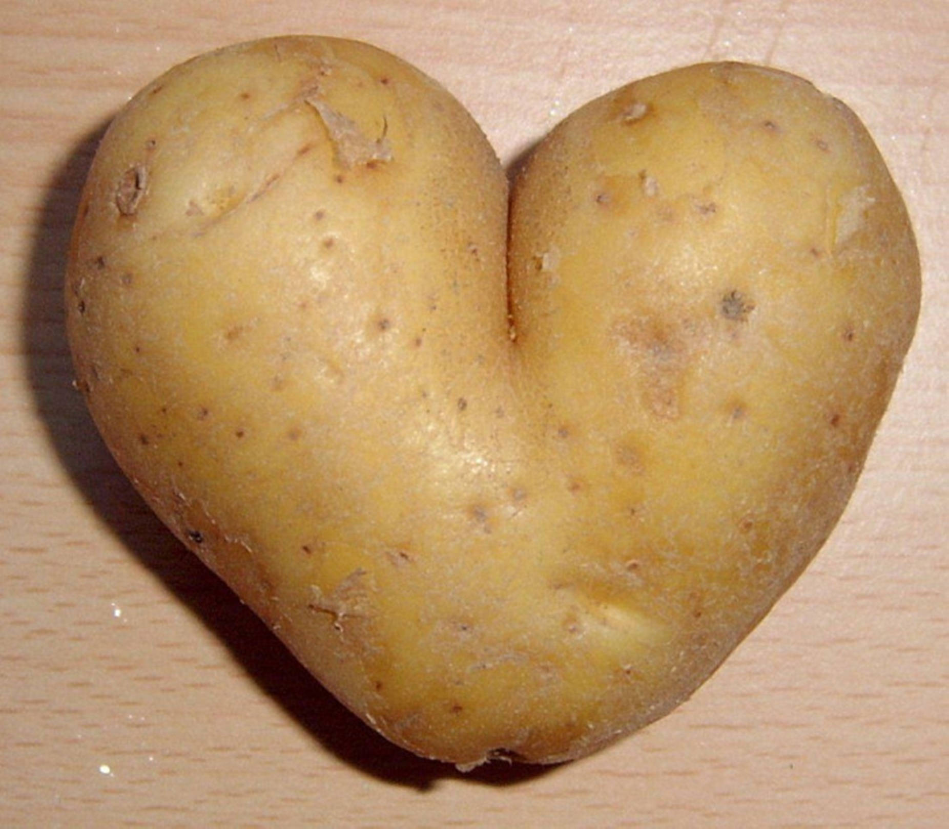 Potato In Lovely Heart Shape Background