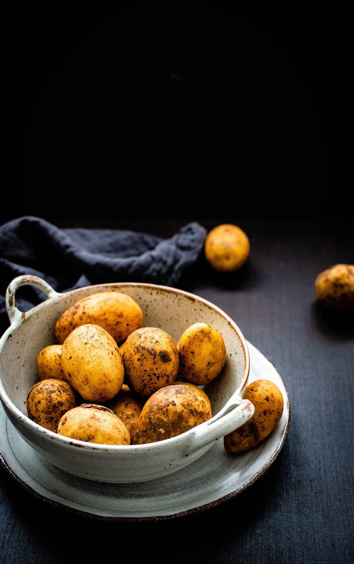 Potatoes On A White Ceramic Bowl Background