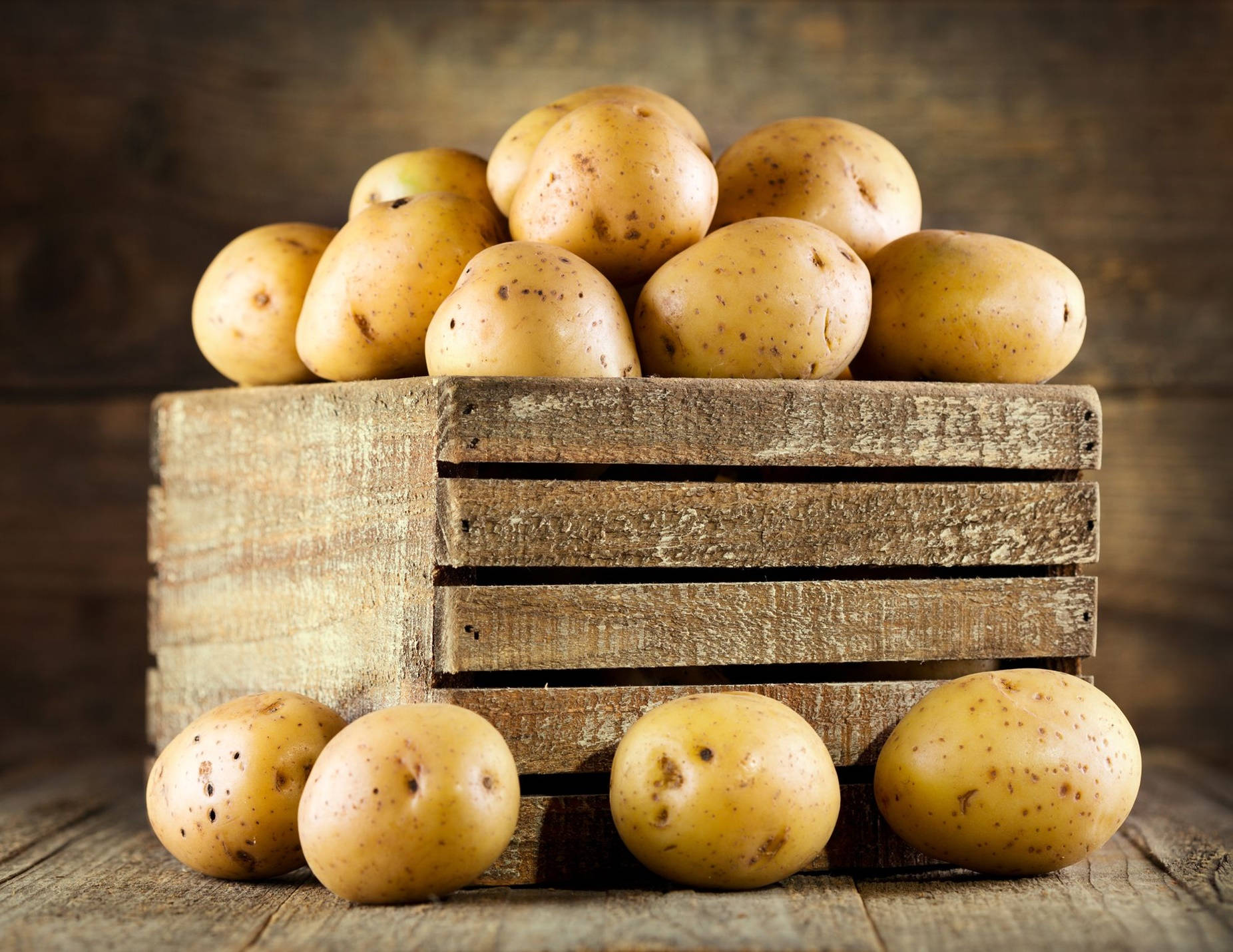 Potatoes On Wooden Crate Pallet Background