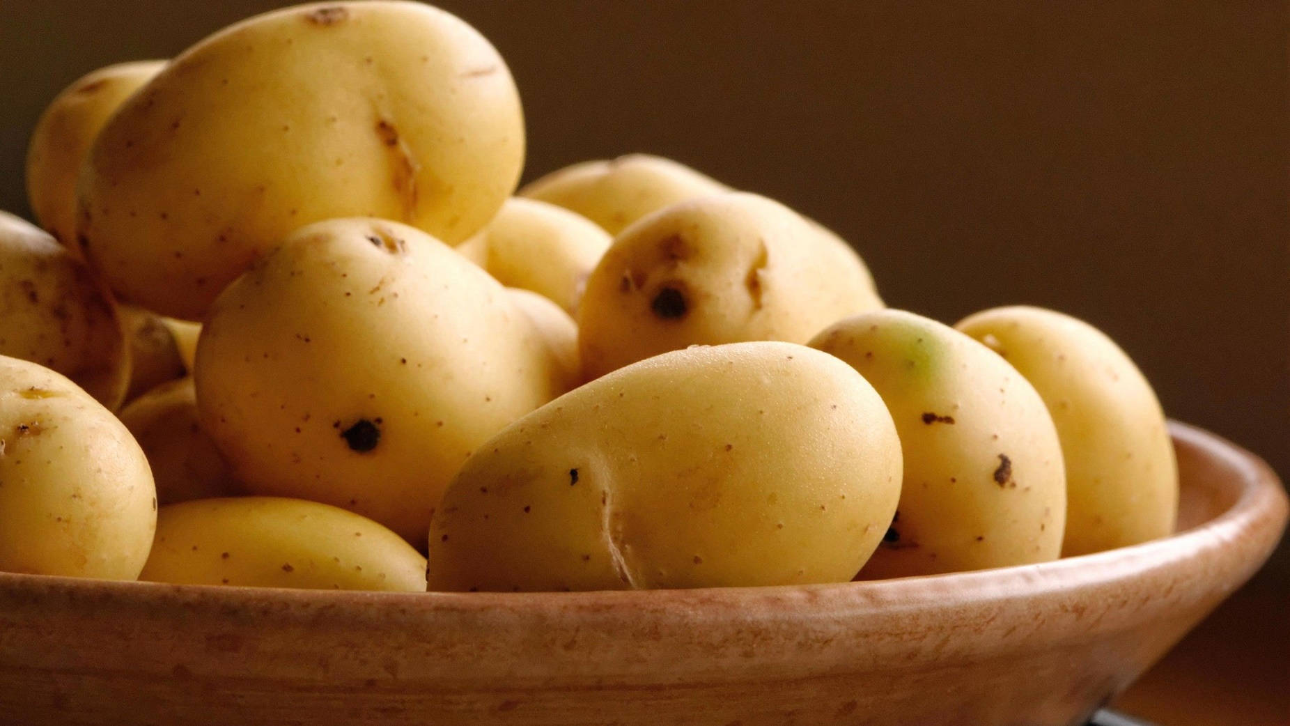 Potatoes Served On A Wooden Bowl Background