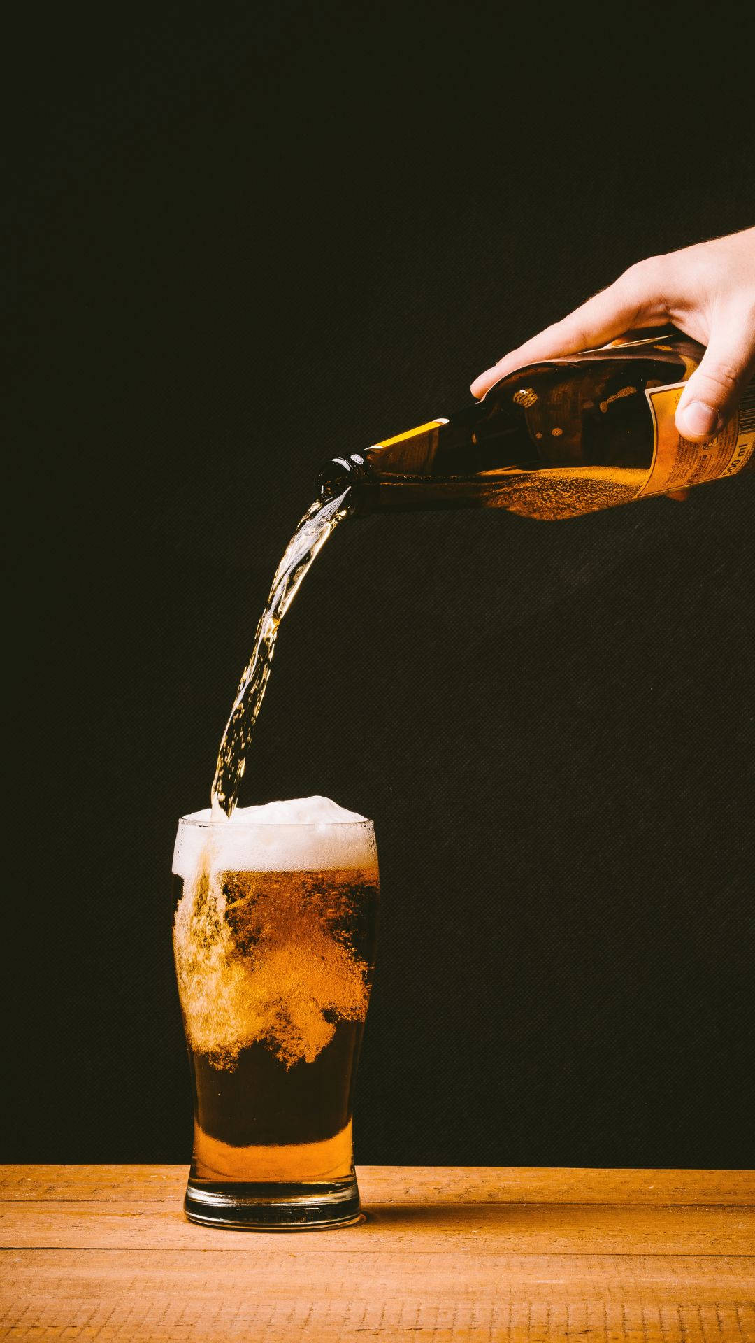 Pouring Glass Of Alcohol With Bubbles