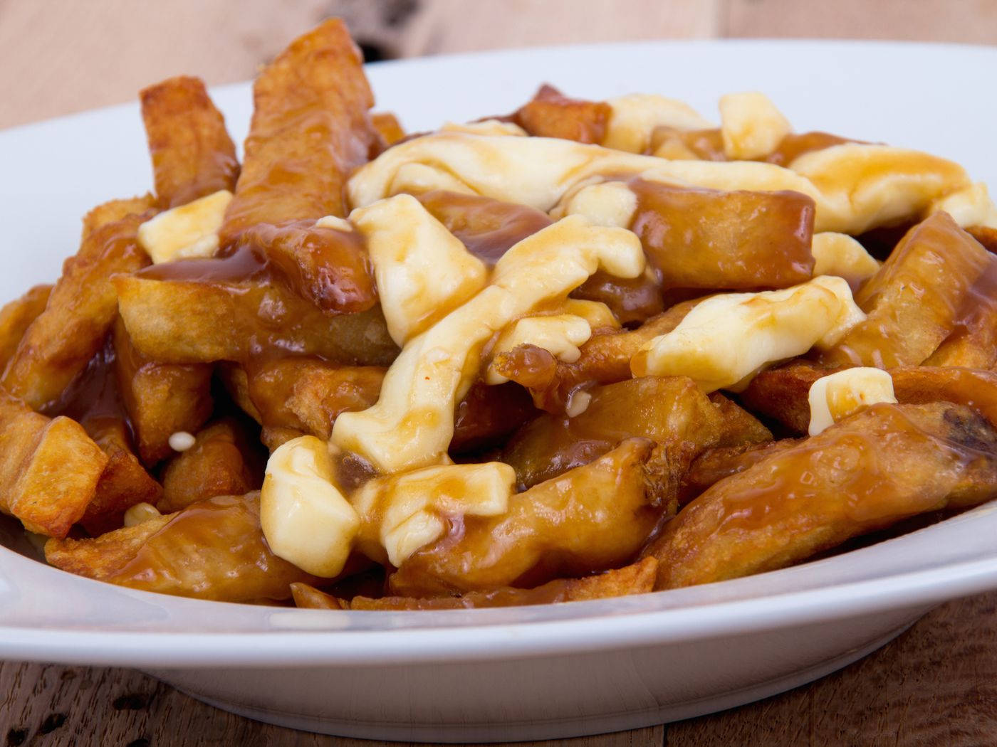 Poutine Crispy Fries And Fresh Cheese Curd Background