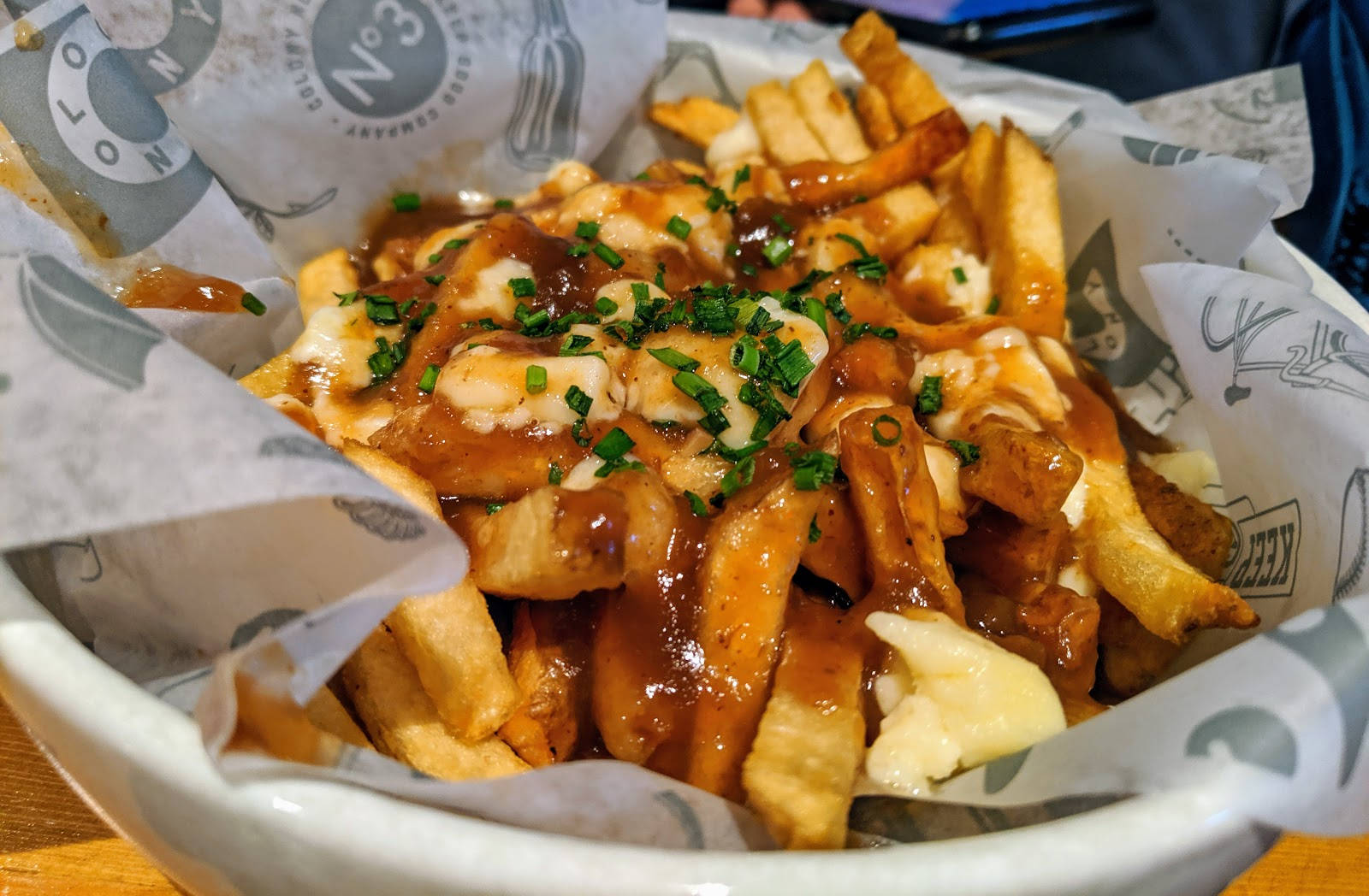 Poutine Snack On Paper Bowl Background