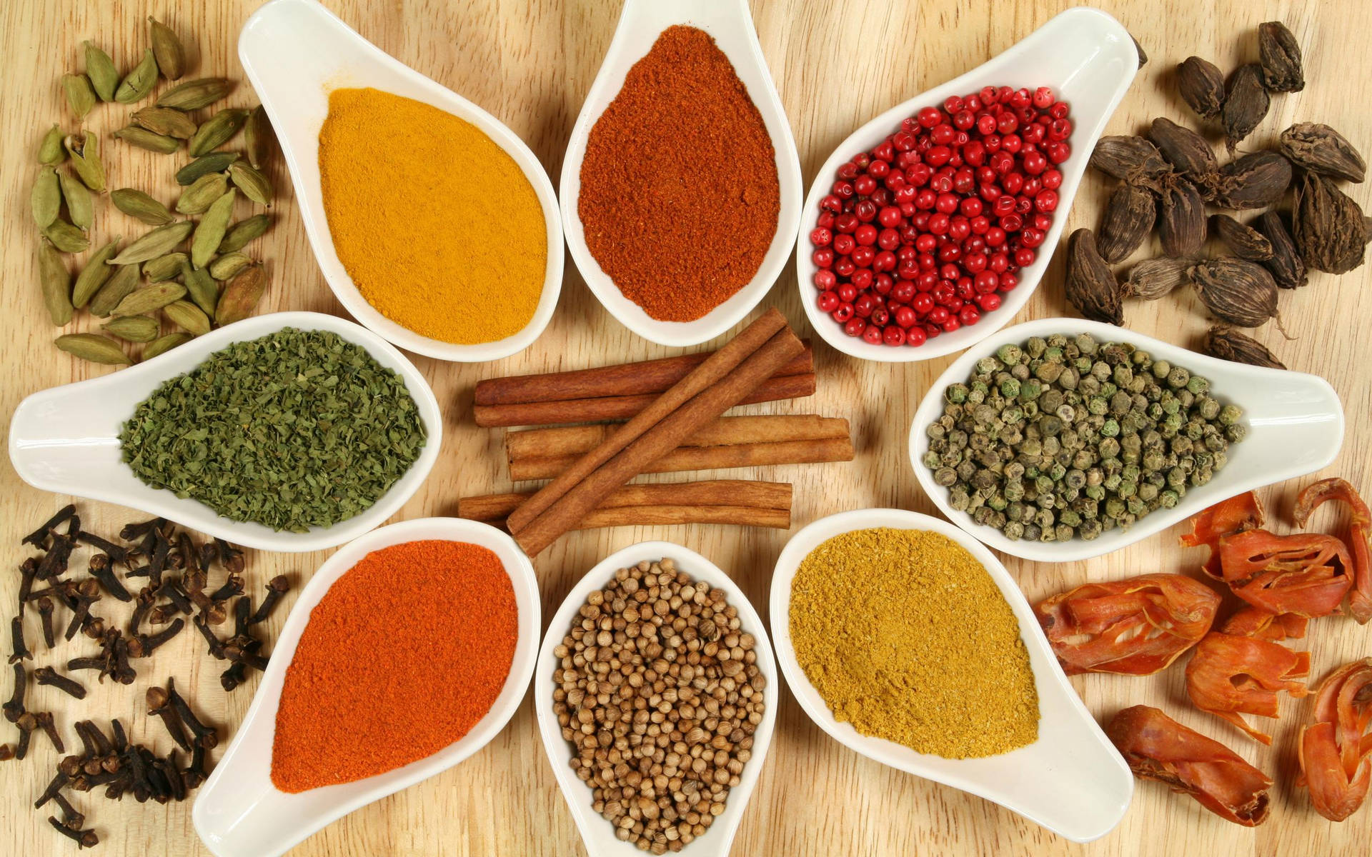 Powdered And Whole Spices On Wooden Surface Background