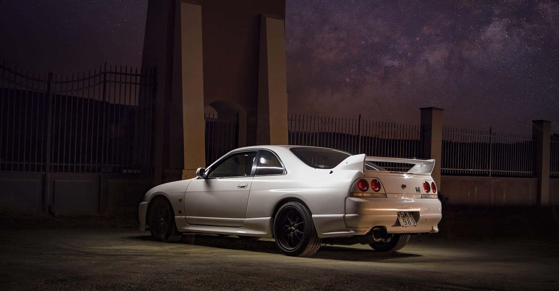 Power And Control Embodied In The Nissan R33 Gtr Background