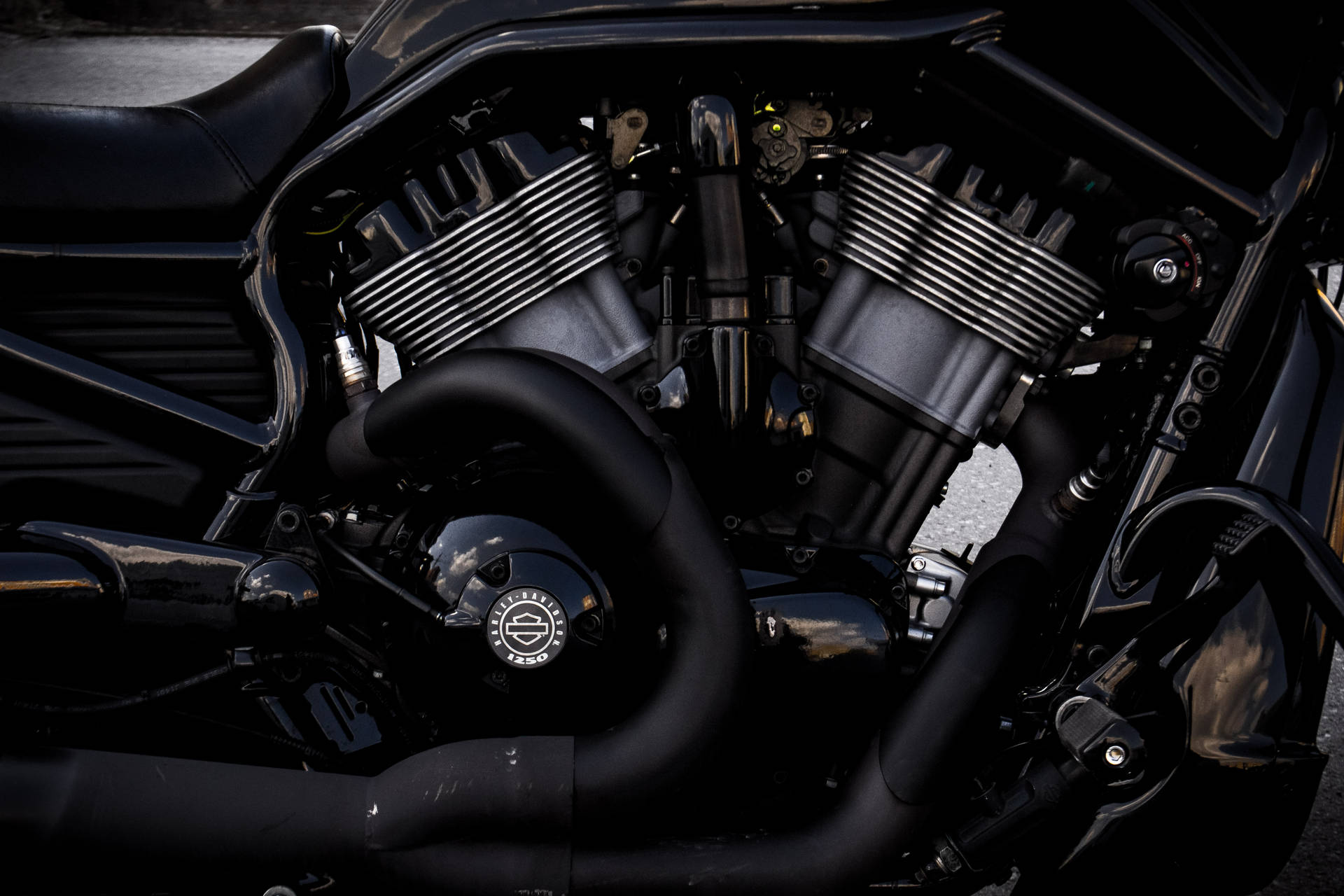 Power Up Your World With A Sleek, Black And Gray Motorcycle Engine. Background