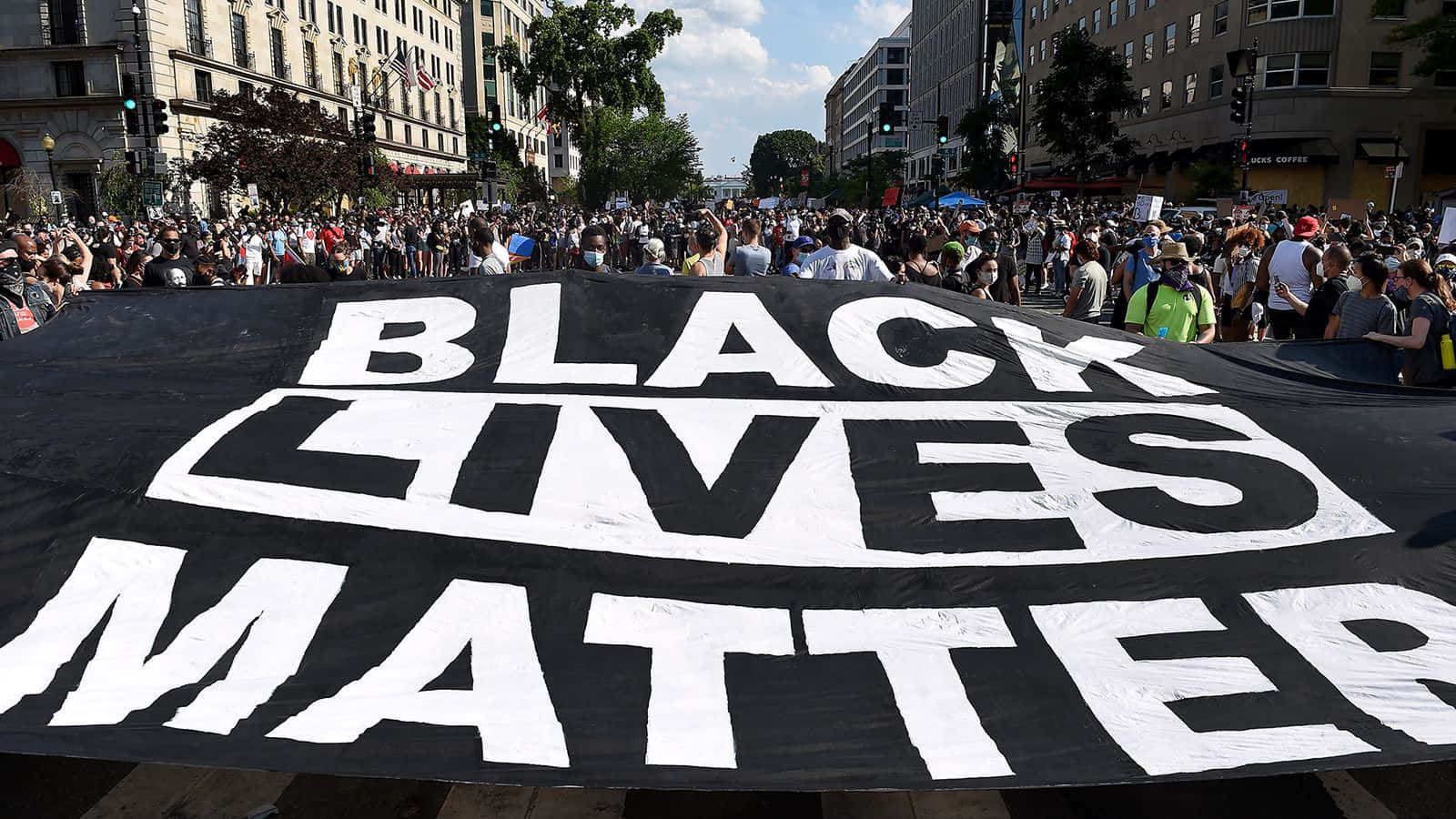 Powerful Anti-racism Slogan Displayed On Black Cloth Background