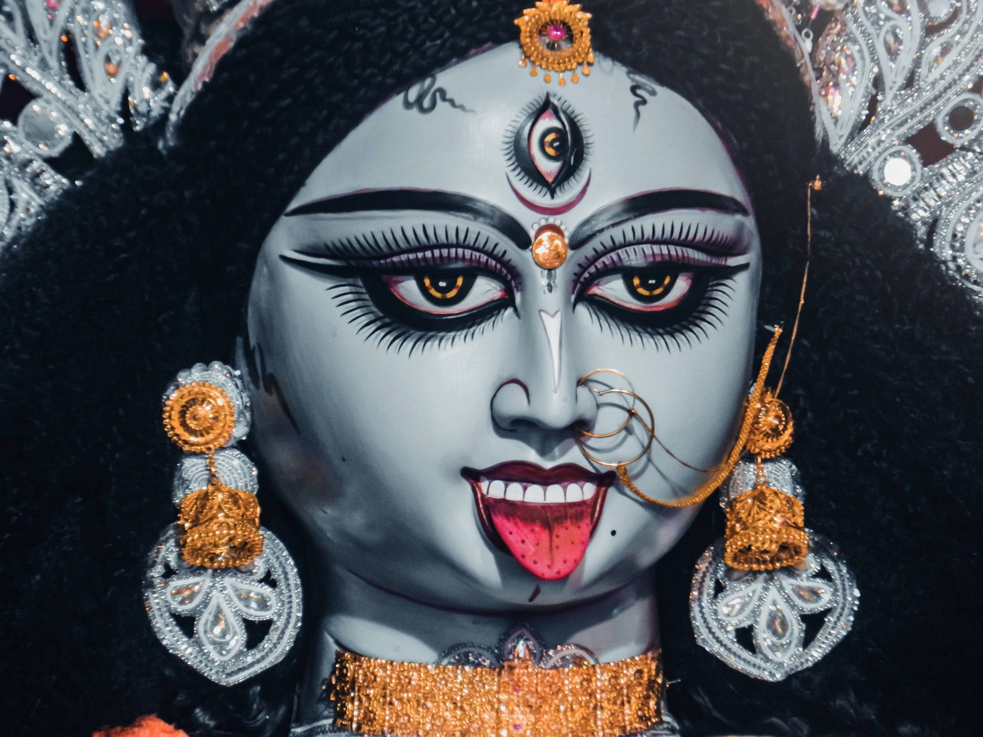 Powerful Divine Representation - Goddess Kali Adorned With Golden Accessories.