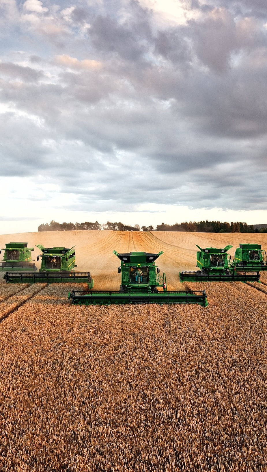 Powerful John Deere Tractor In Action Background