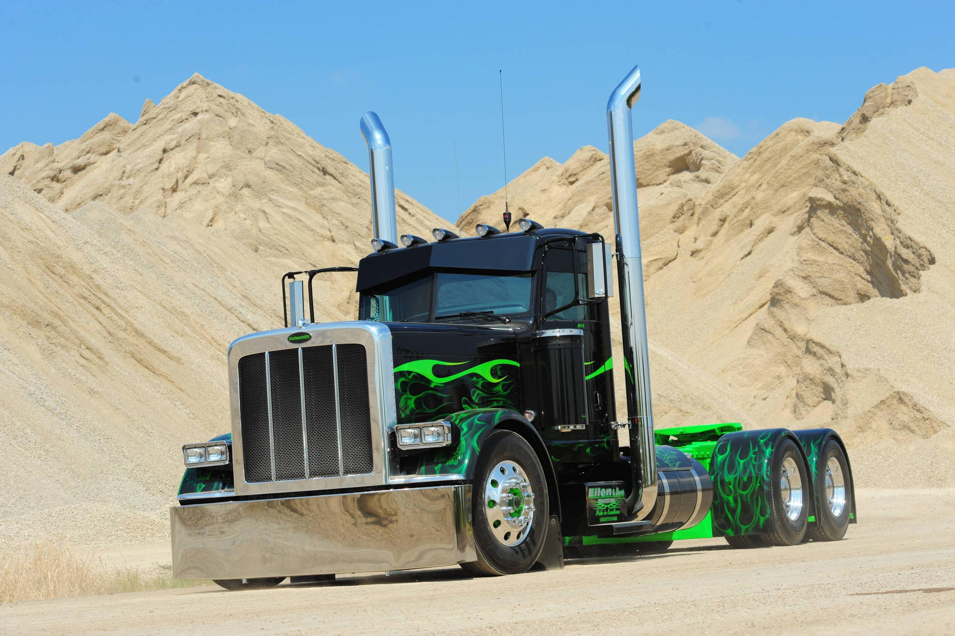 Powerful Peterbilt Trucks Ready To Transport Goods Background