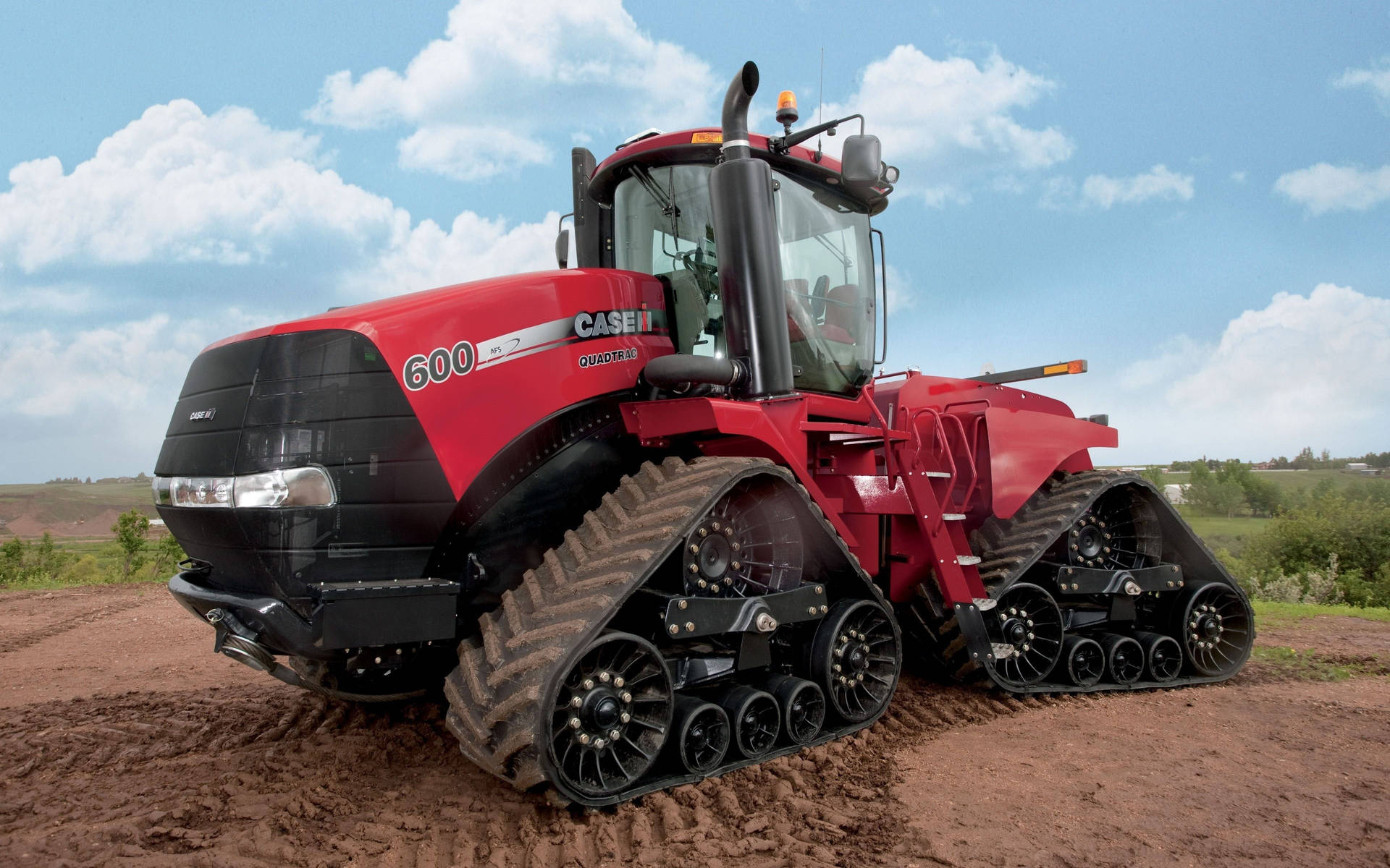 Powerful Red Case Stx Steiger Tractor In A Field Background