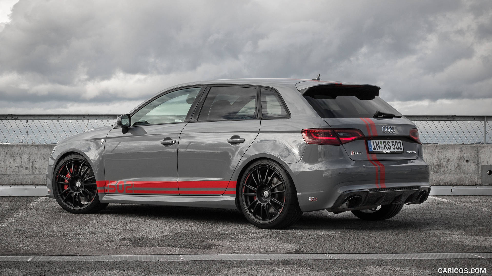 Powerful Sophistication - Grey Audi Rs With Red Accents Background