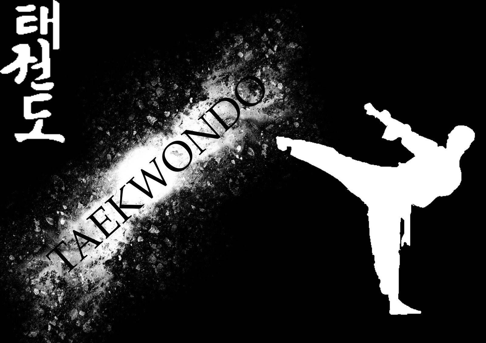 Powerful Taekwondo Martial Artist In Action Background