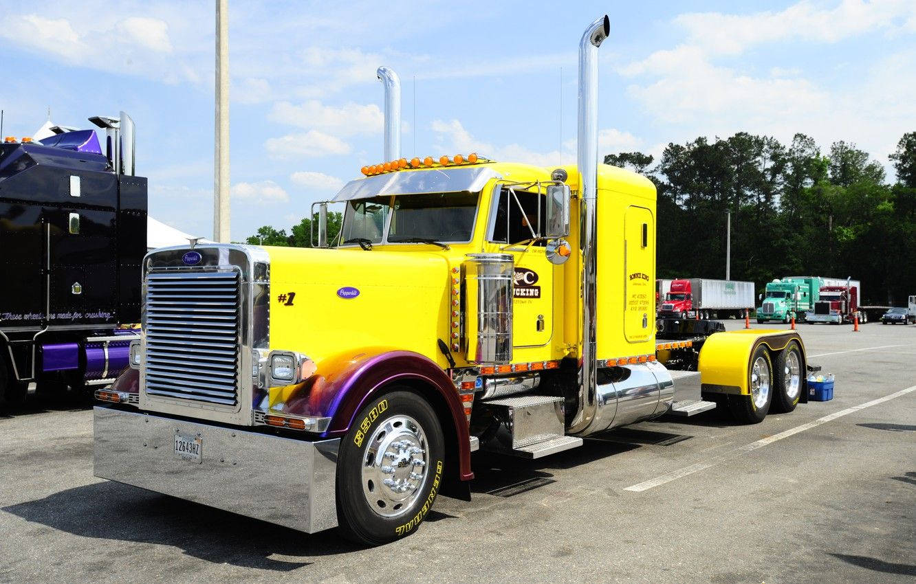 Powerful Yellow Cool Truck Cruising On The Open Road