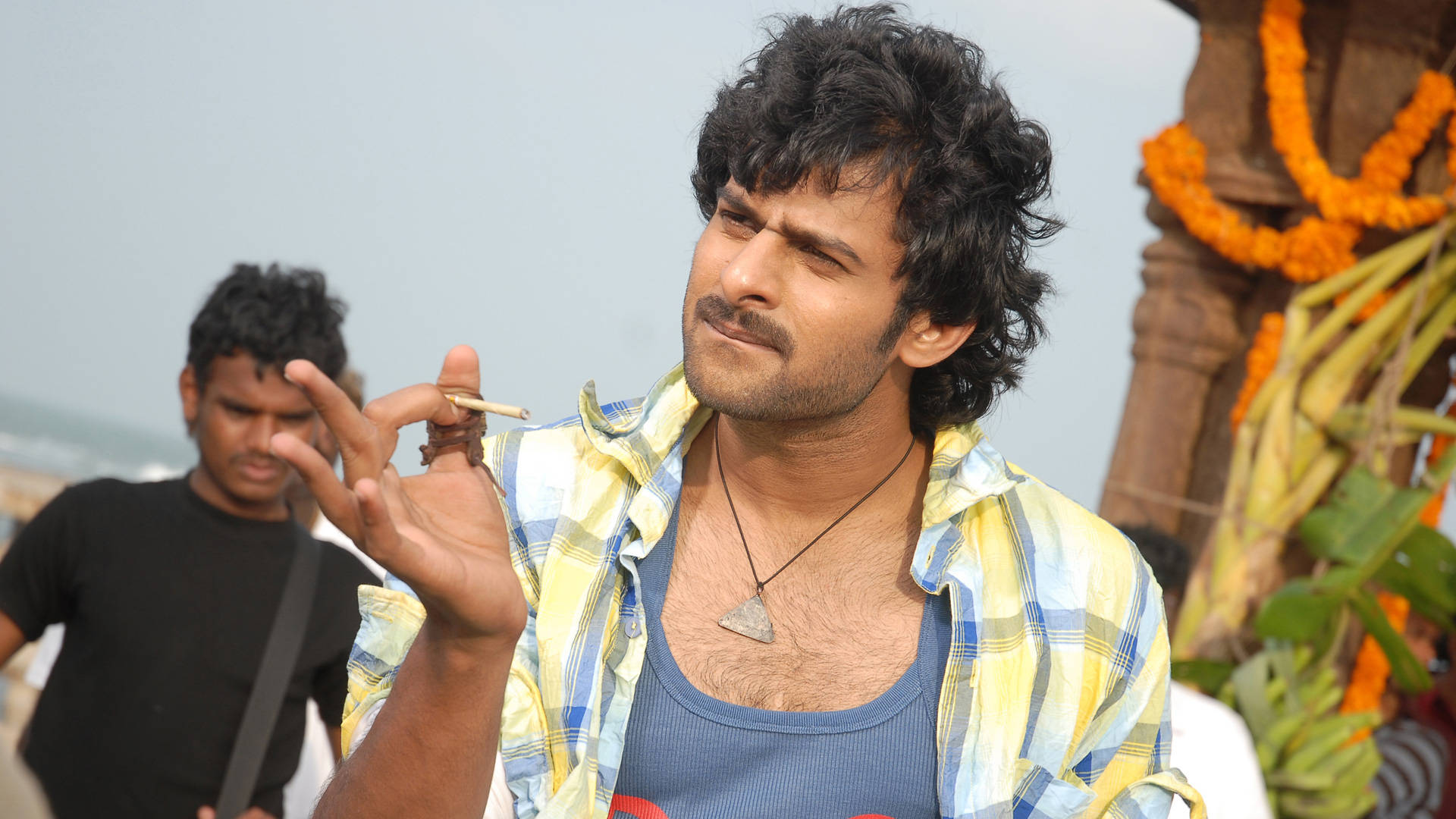 Prabhas Hd Flicking Away A Cigarette Background