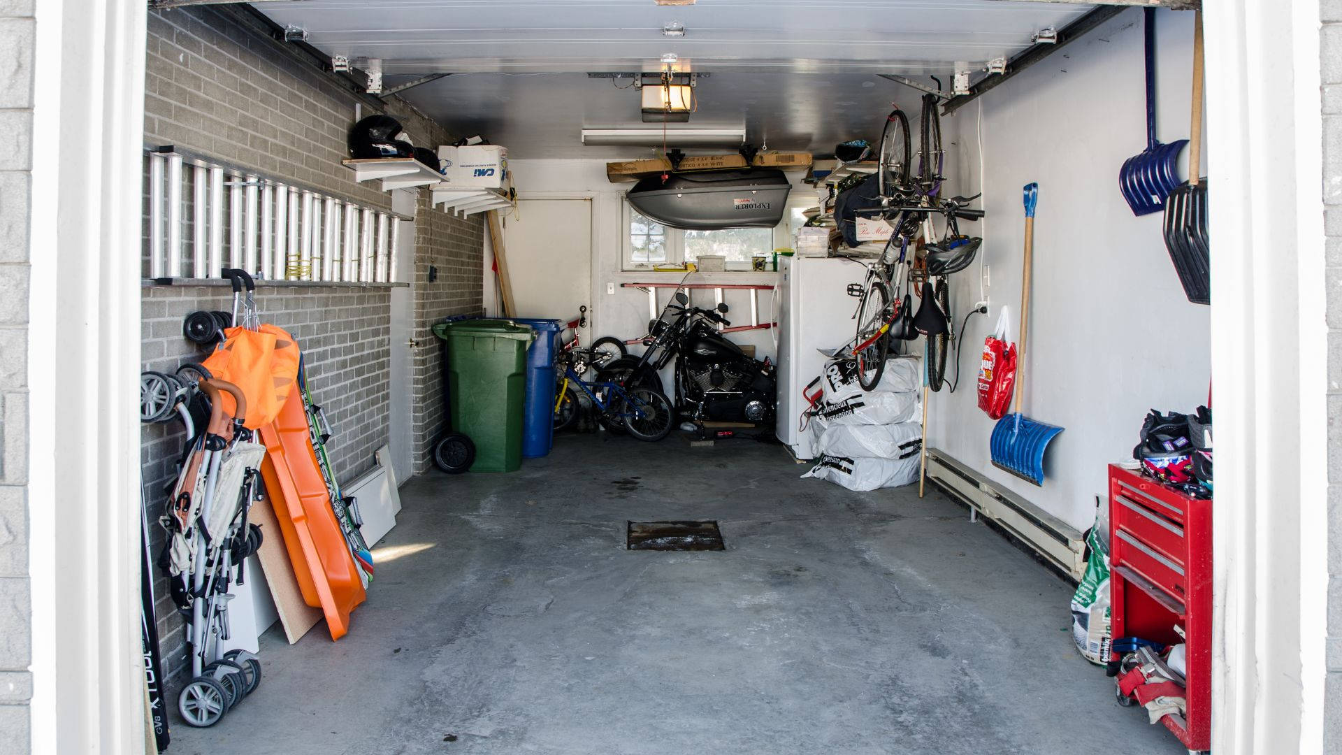 Practical And Efficient Garage Space Showing Car And Tools Storage