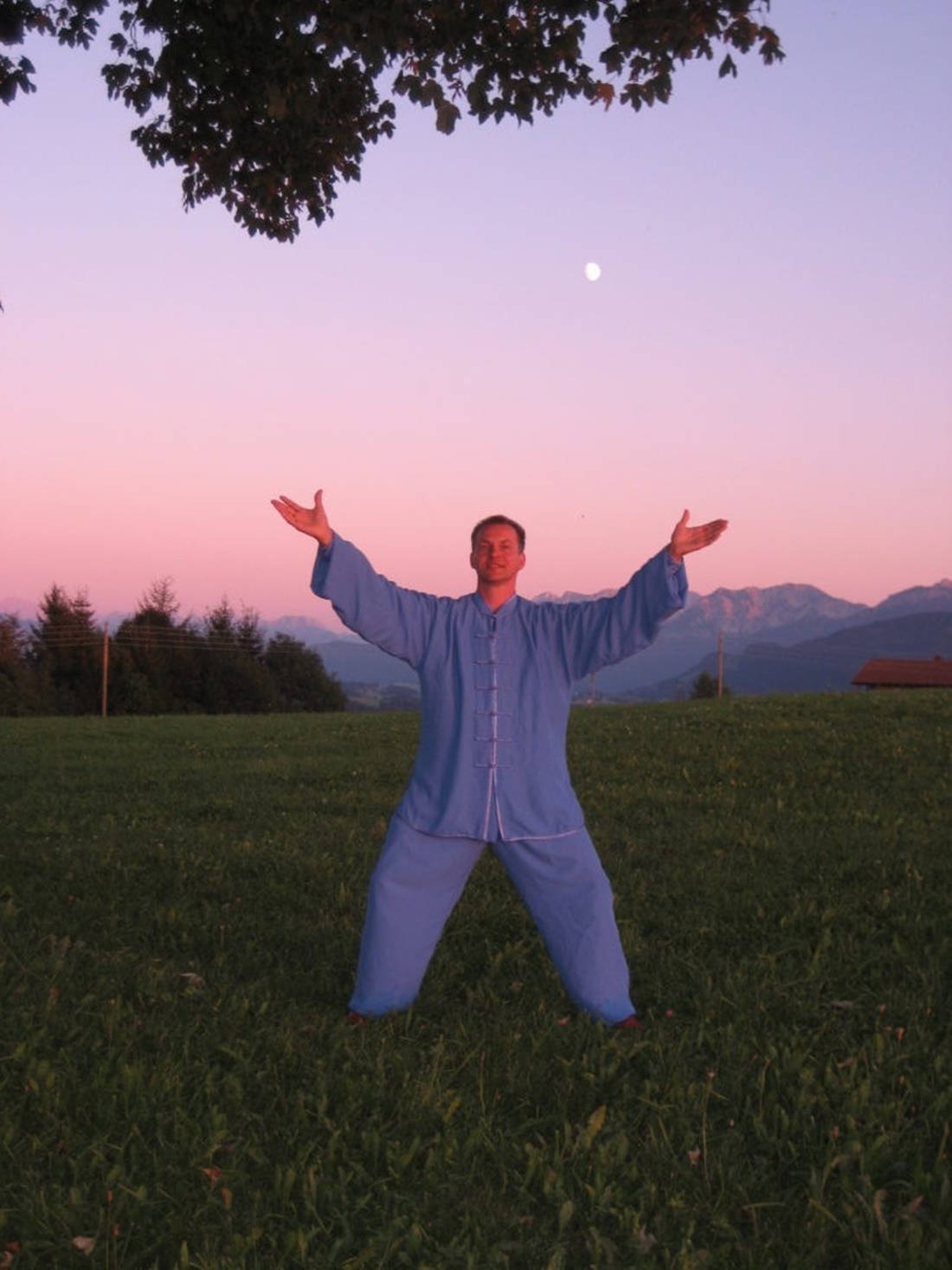 Practicing Qi Gong Meditation In Harmonious Natural Setting Background