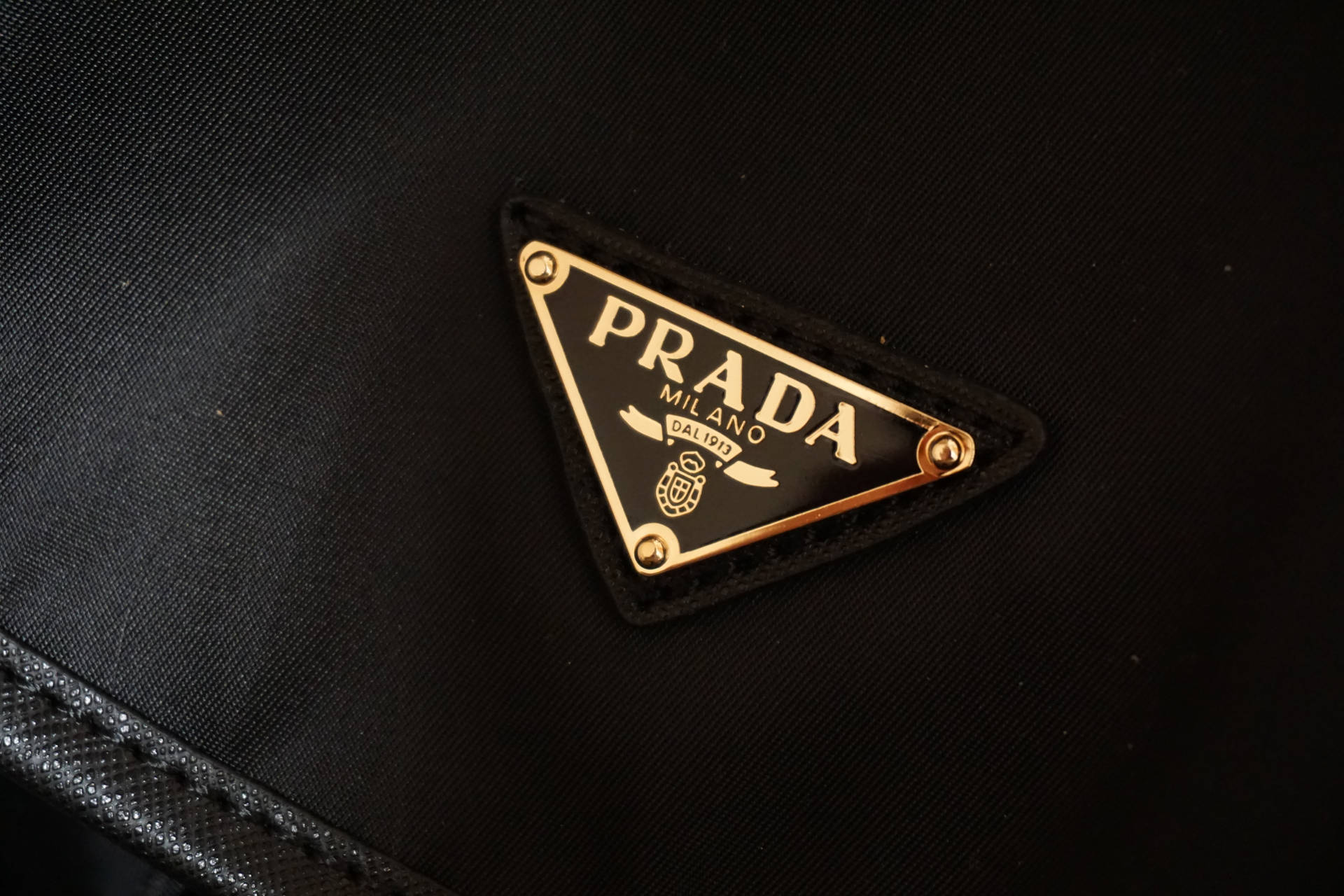 Prada Gold Badge Background
