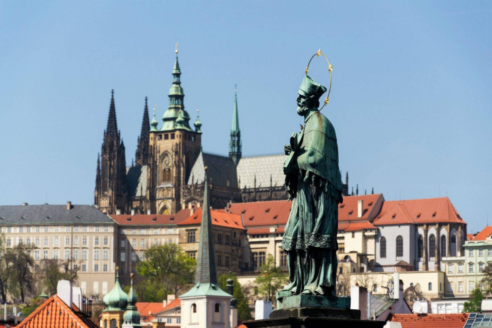 Prague Castle And Historic Statue At Sunset Background