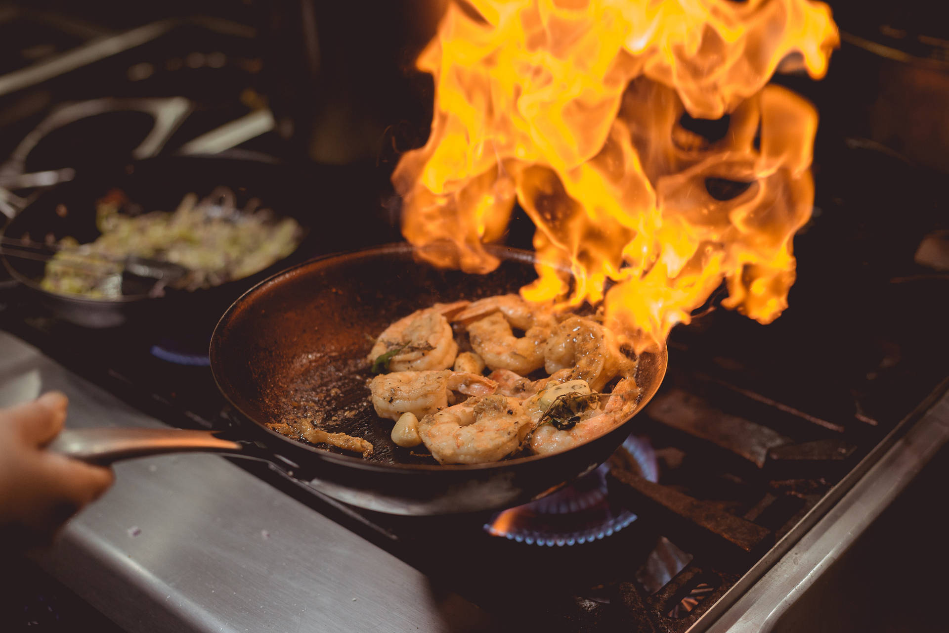 Prawns Flambé On A Wok Pan Background