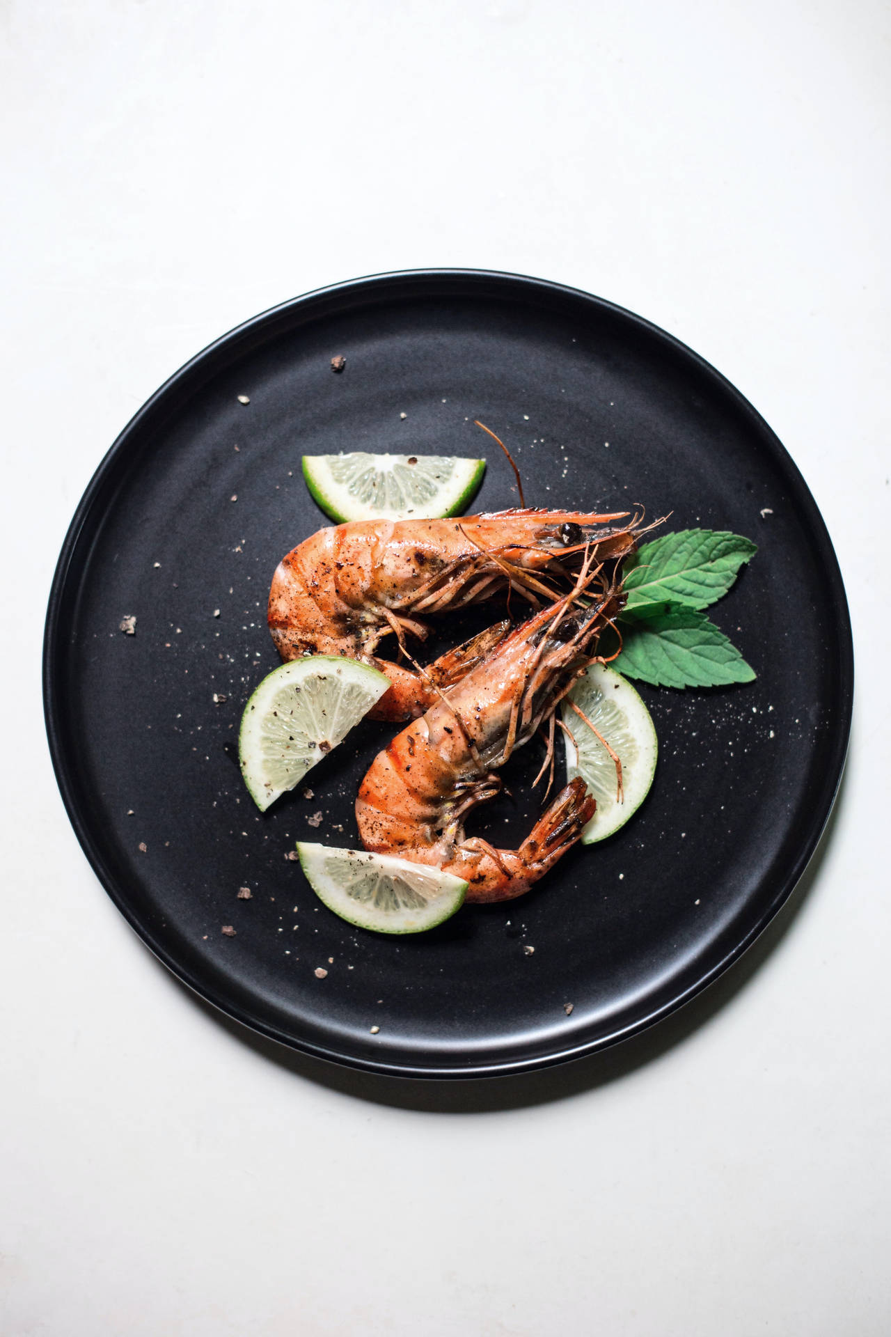 Prawns With Lime Slices And Basil Background