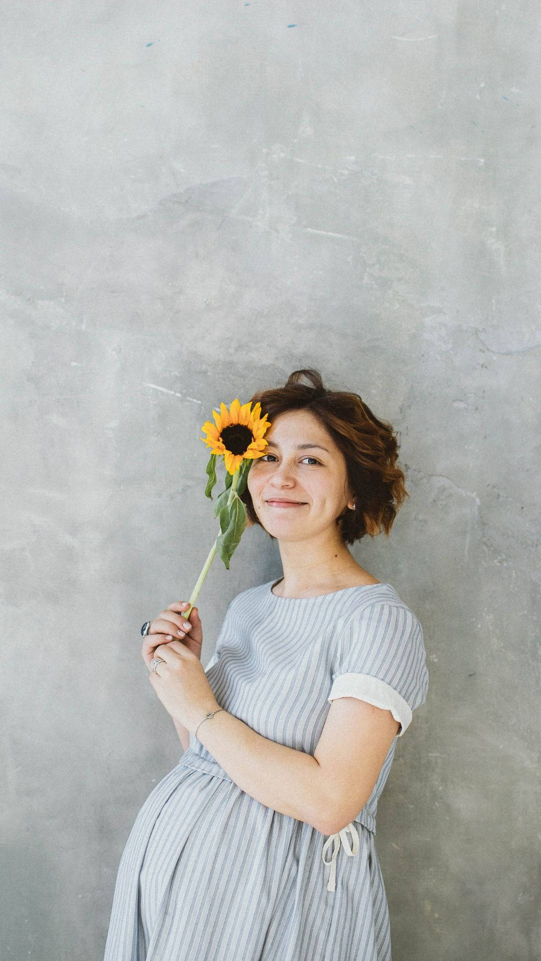 Pregnancy Woman Holding Sunflower