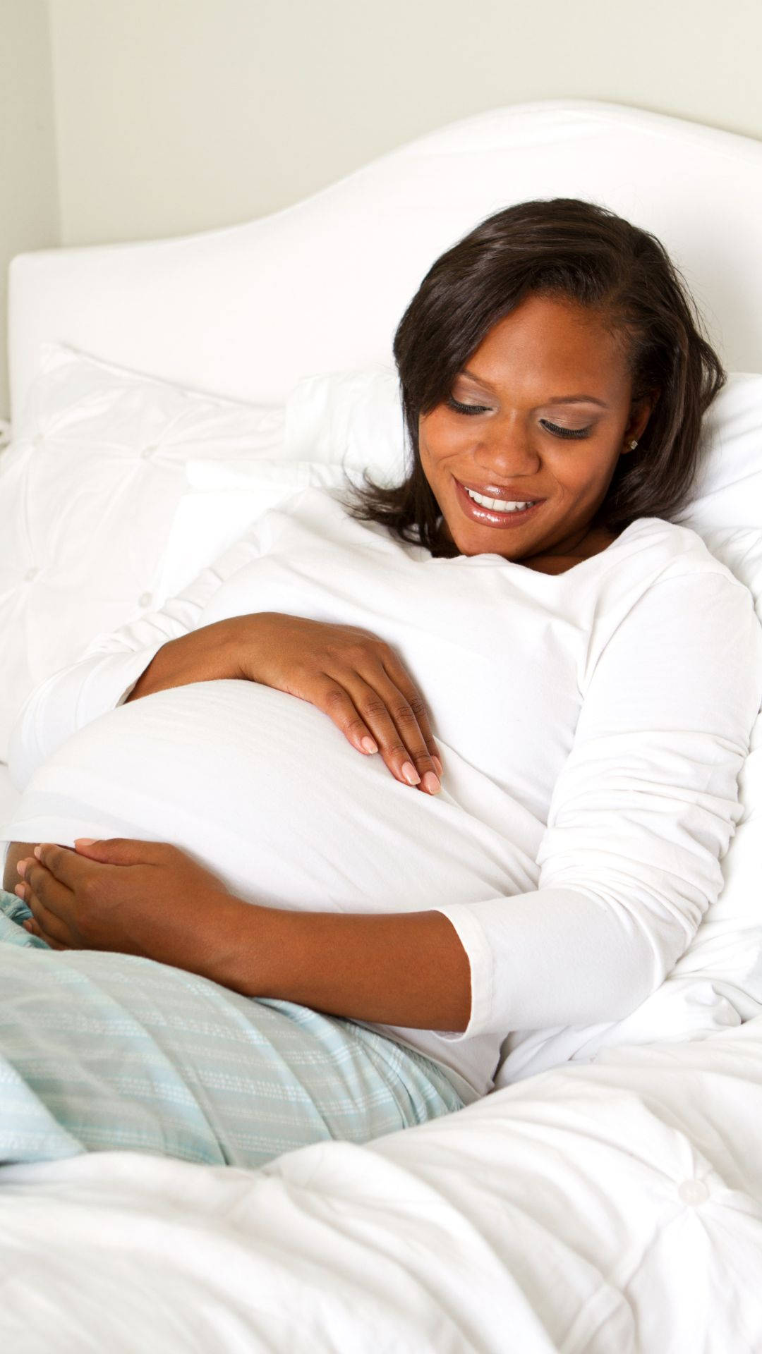 Pregnancy Woman Lying On Bed Background