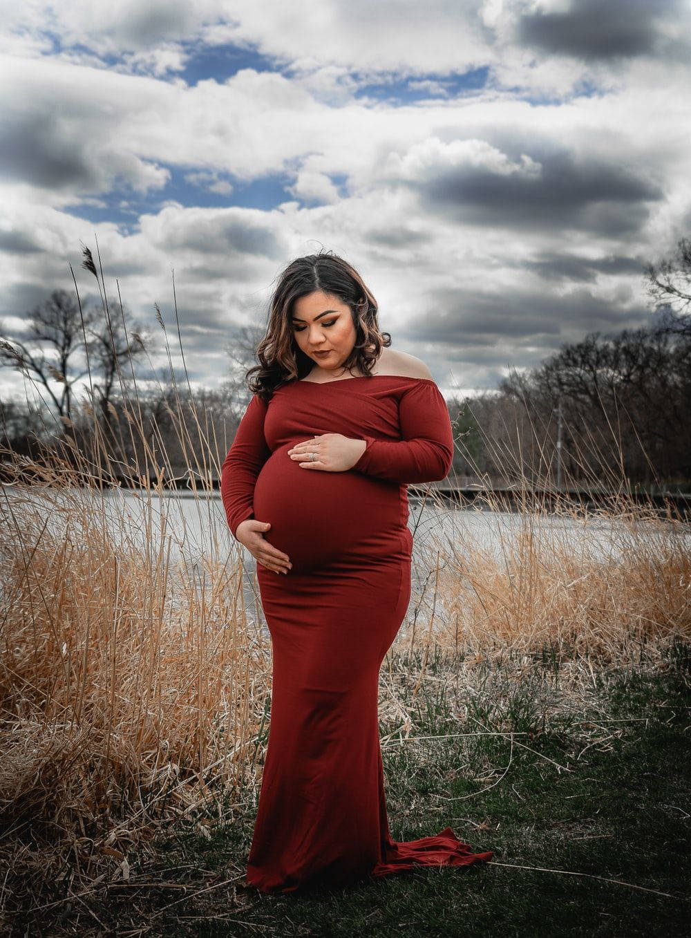 Pregnant Belly Red Dress Outside Background