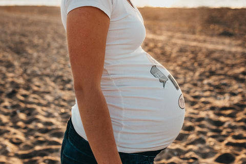 Pregnant Belly Sandy Background Background